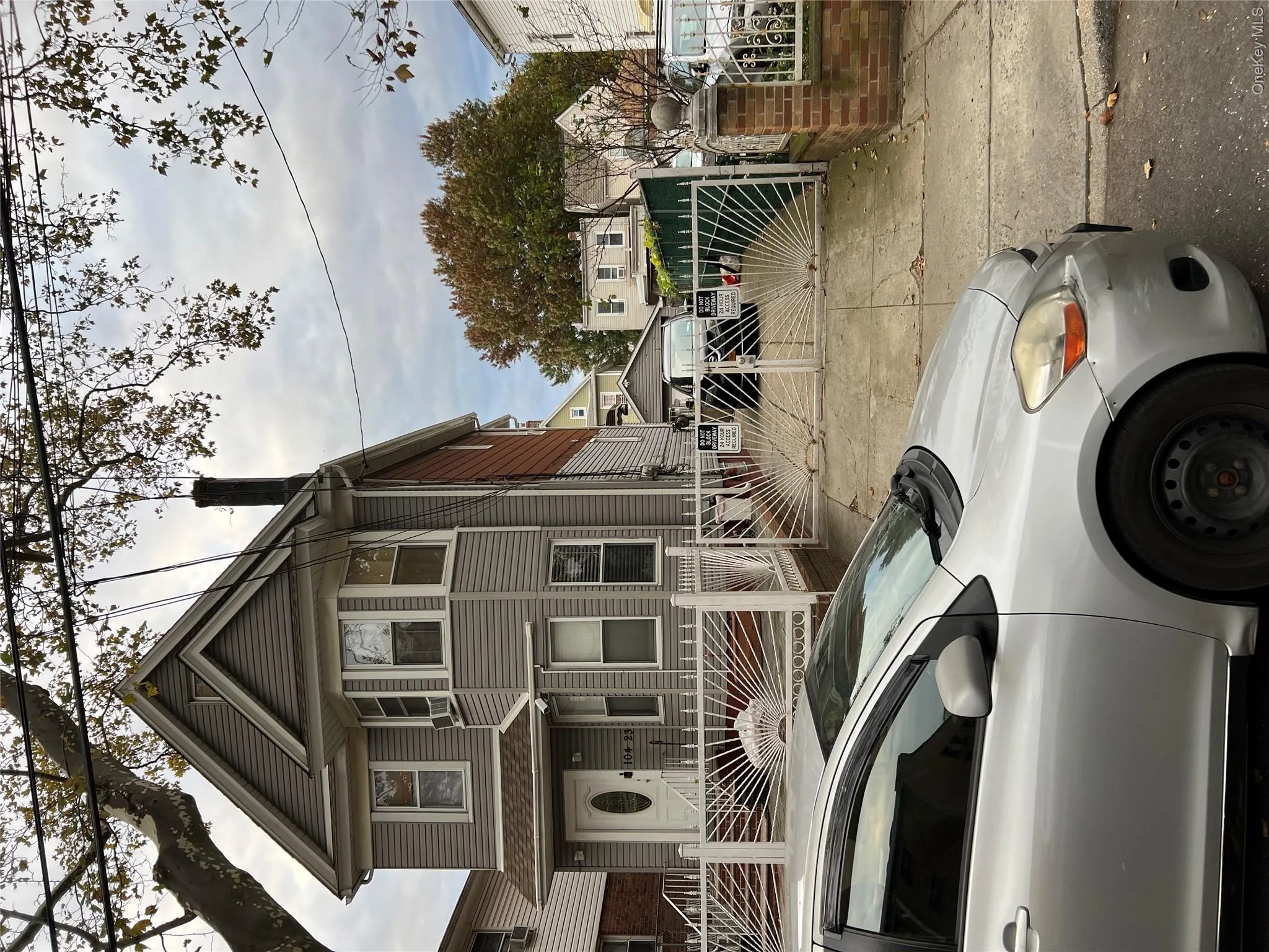 View of front of home featuring a fenced front yard, a gate, and a chimney View of front of home featuring a fenced front yard, a gate, and a chimney