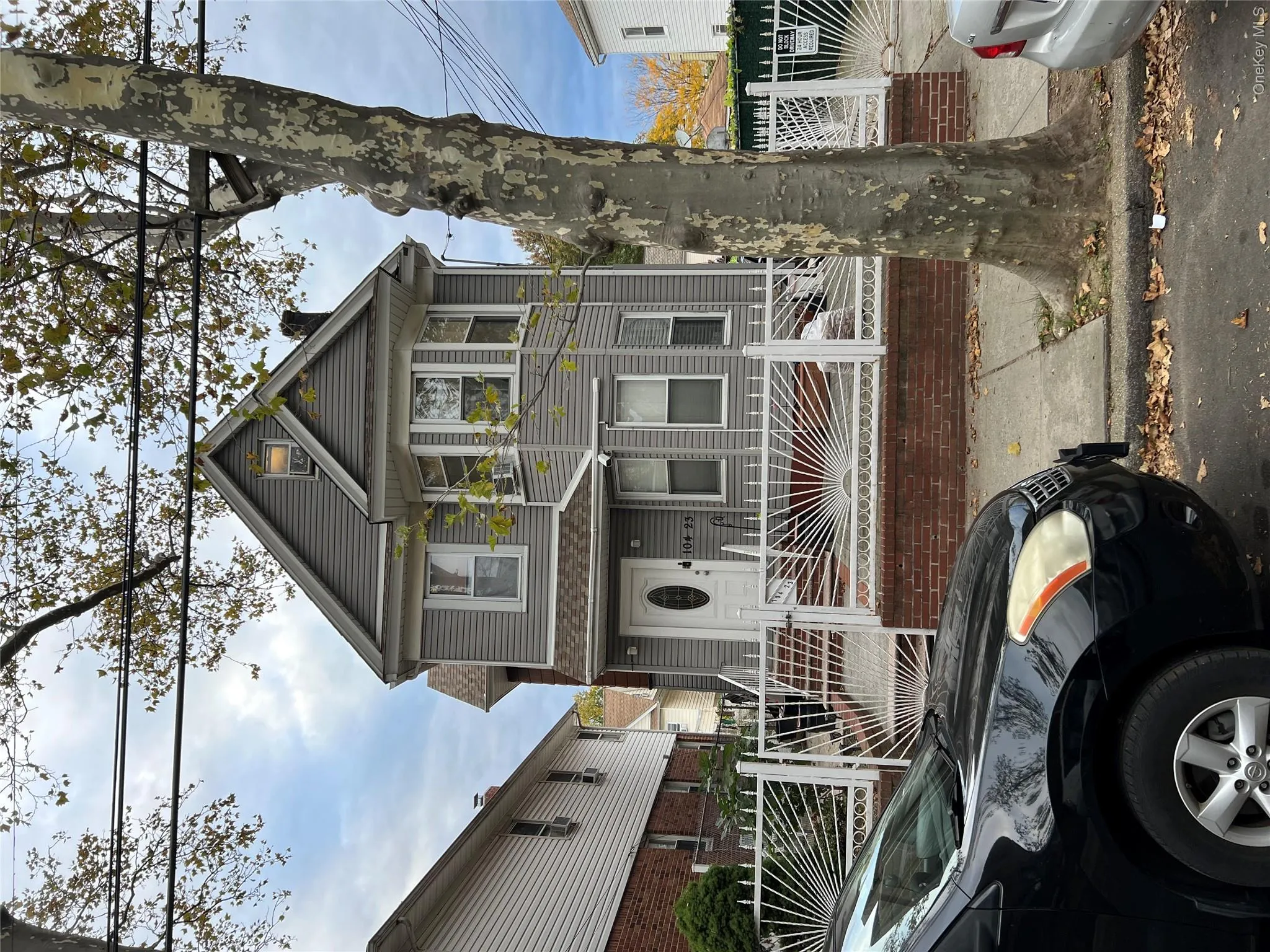 Victorian house with a fenced front yard, a chimney, and a gate Victorian house with a fenced front yard, a chimney, and a gate