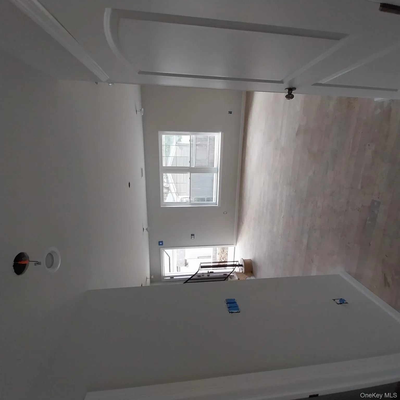 Corridor with baseboards and wood finished floors Corridor with baseboards and wood finished floors