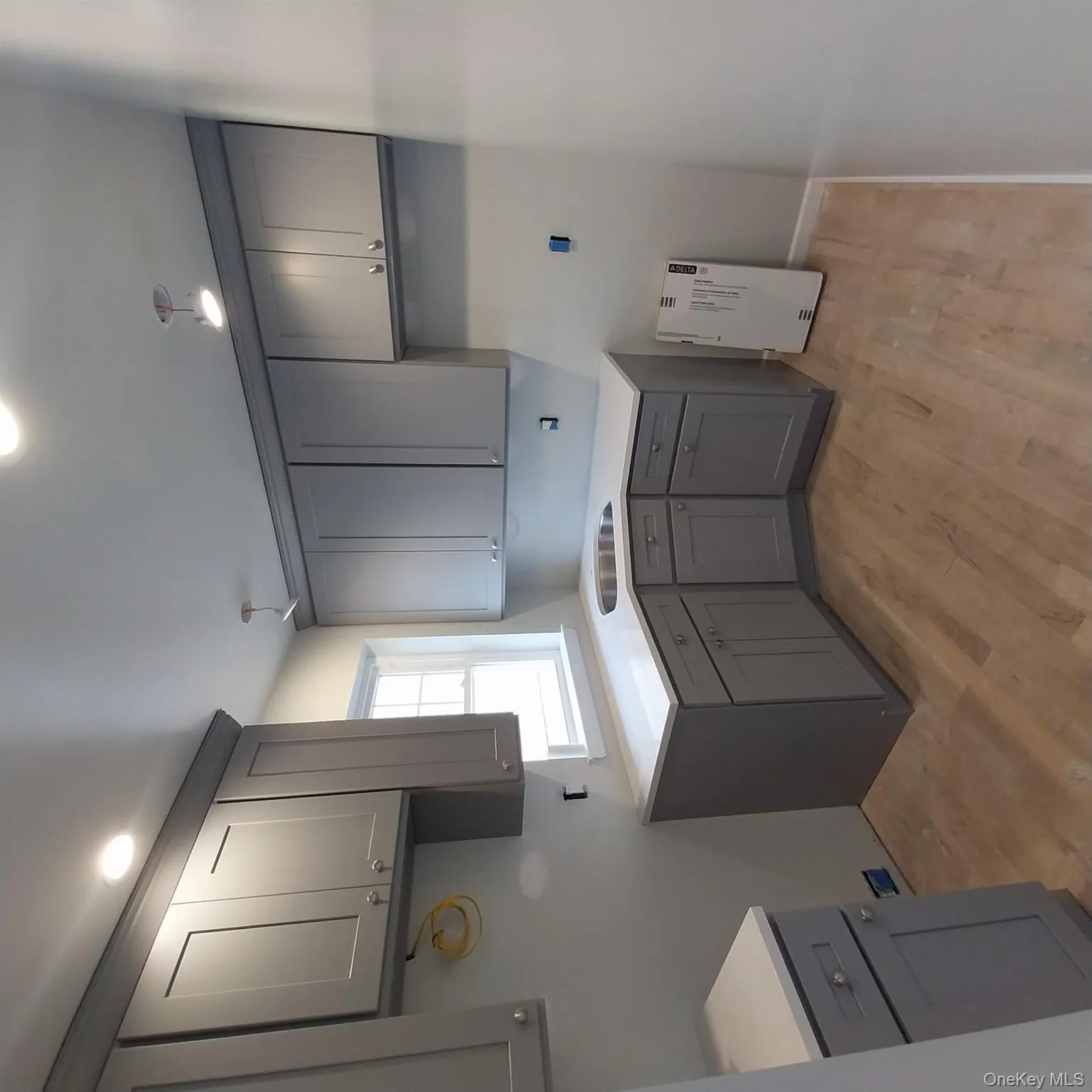Laundry area featuring light wood finished floors and recessed lighting Laundry area featuring light wood finished floors and recessed lighting