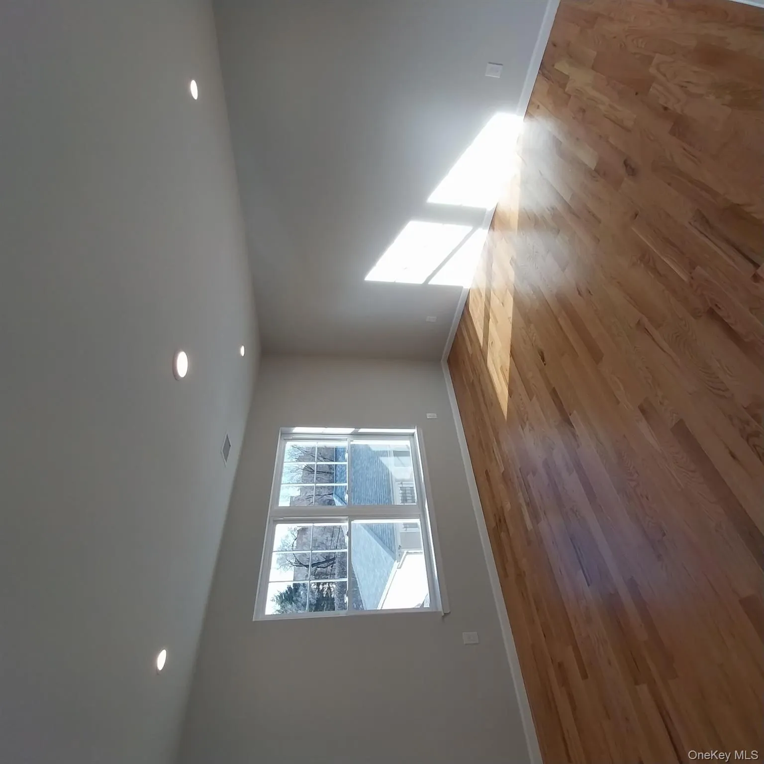 Spare room with light wood-style floors and recessed lighting Spare room with light wood-style floors and recessed lighting