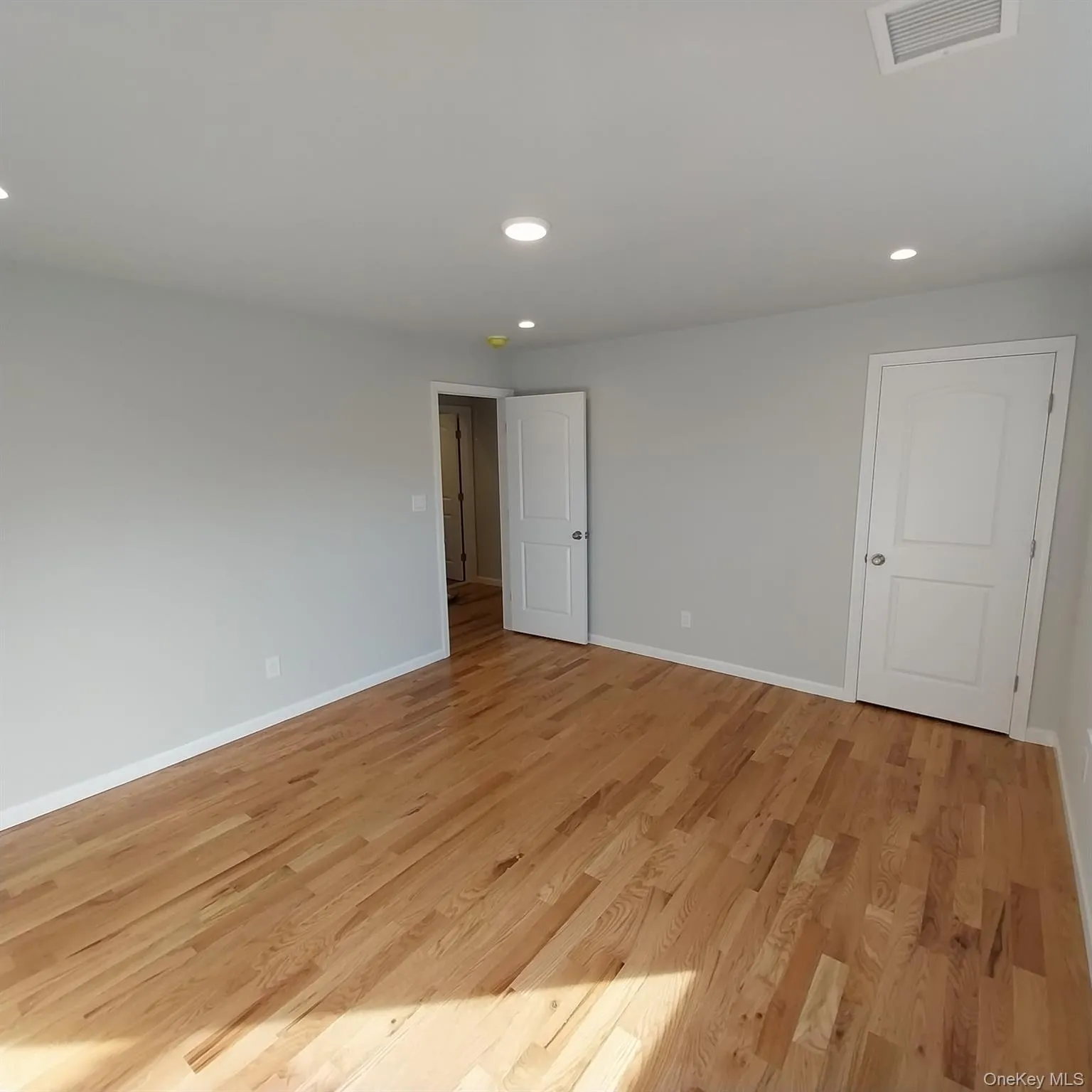 Empty room featuring recessed lighting and light wood-type flooring Empty room featuring recessed lighting and light wood-type flooring