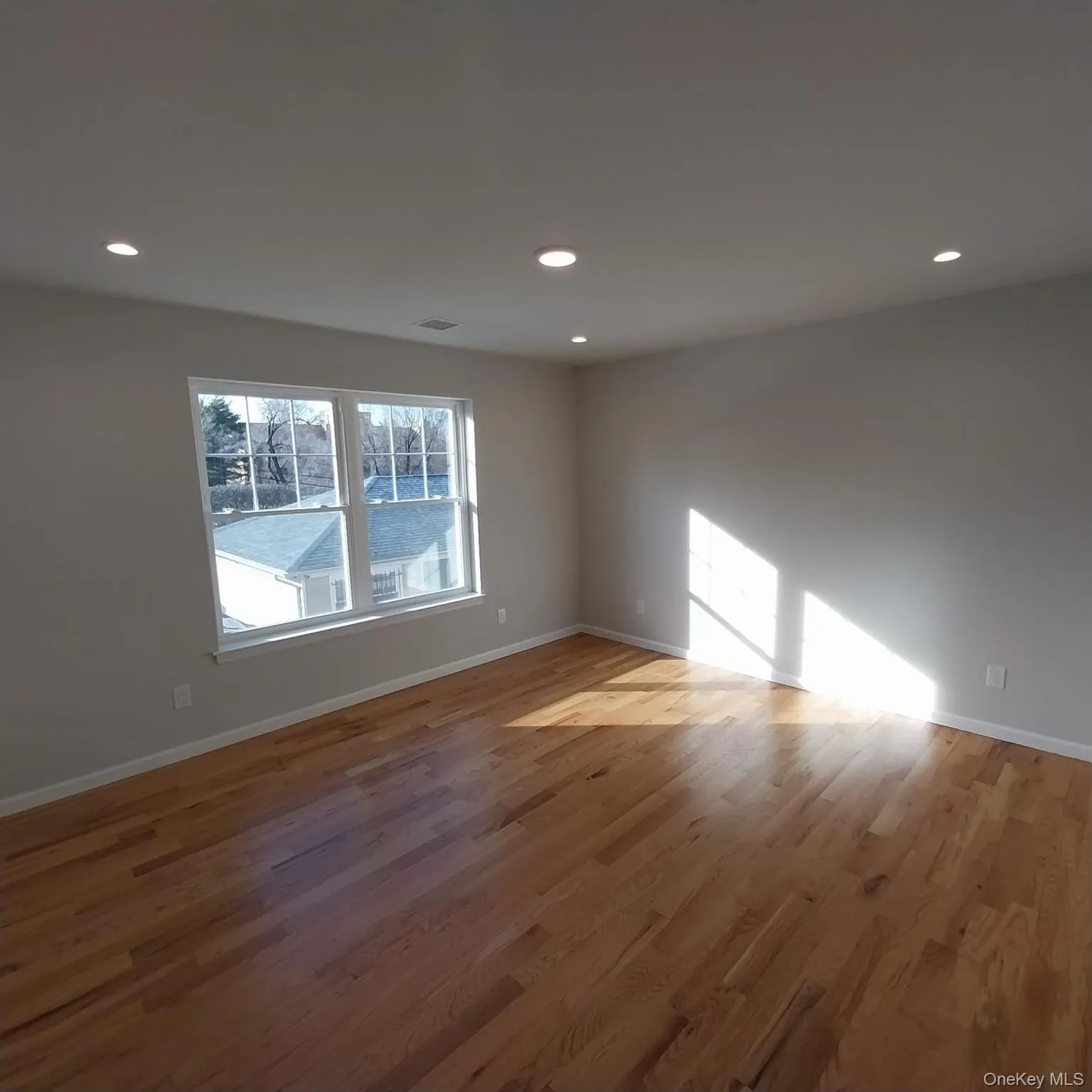 Empty room featuring light wood-style floors and recessed lighting Empty room featuring light wood-style floors and recessed lighting