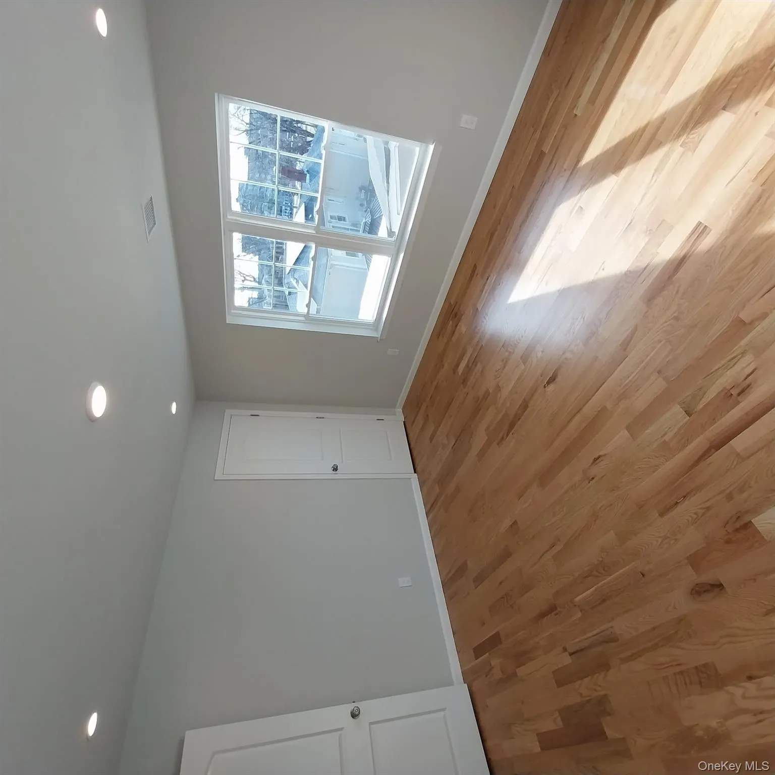 Spare room with light wood-style floors and recessed lighting Spare room with light wood-style floors and recessed lighting