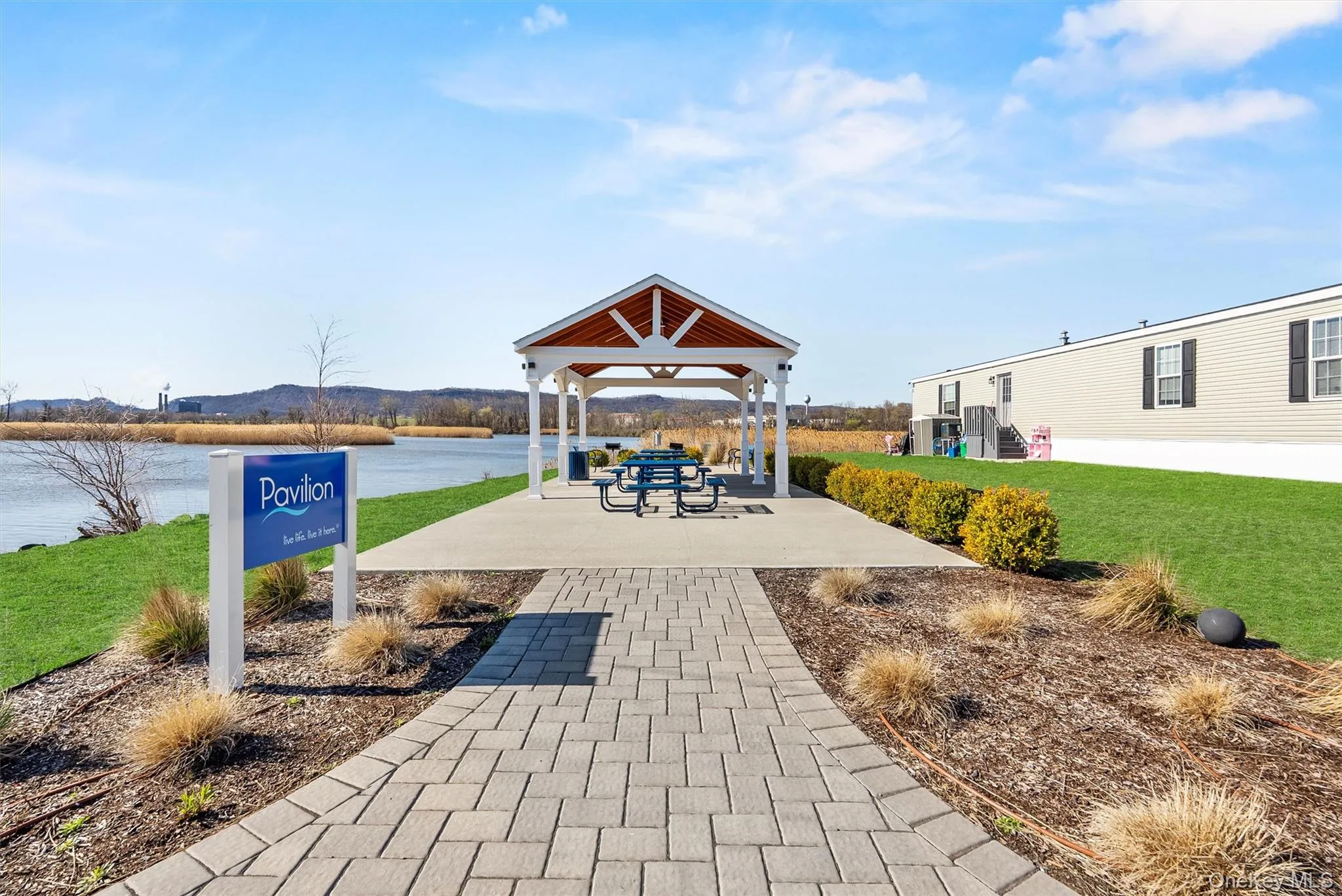 View of home's community with a gazebo, a water view, and a yard View of home's community with a gazebo, a water view, and a yard