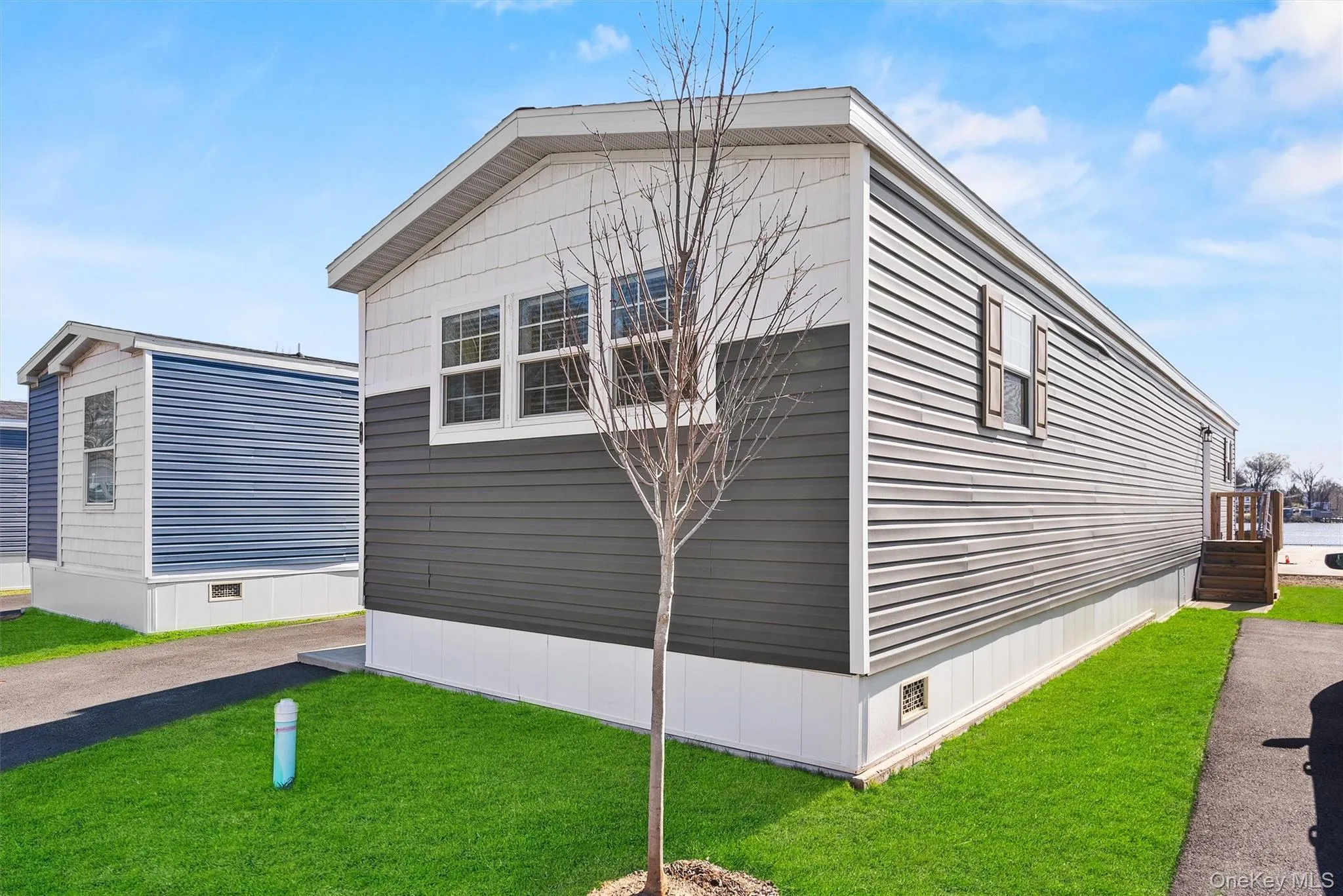 View of home's exterior featuring a yard View of home's exterior featuring a yard