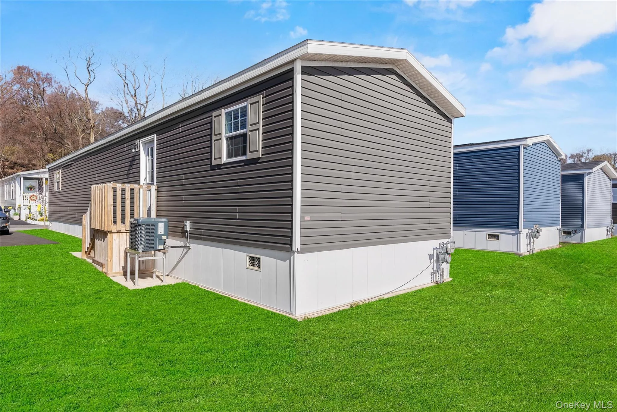 View of home's exterior featuring crawl space, cooling unit, and a lawn View of home's exterior featuring crawl space, cooling unit, and a lawn