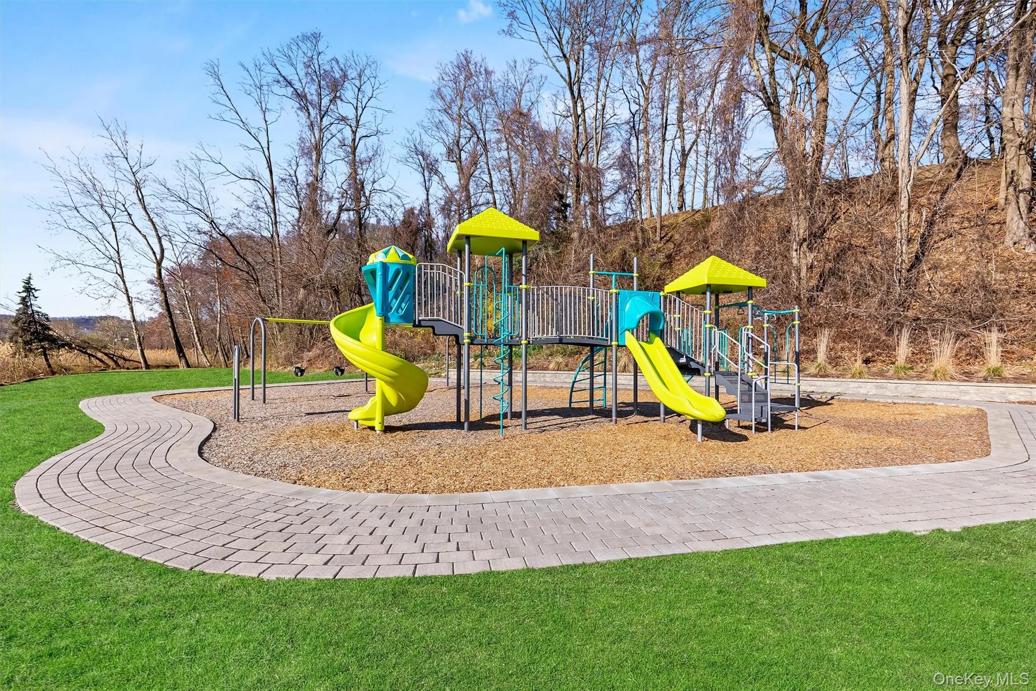 Community jungle gym featuring a yard Community jungle gym featuring a yard