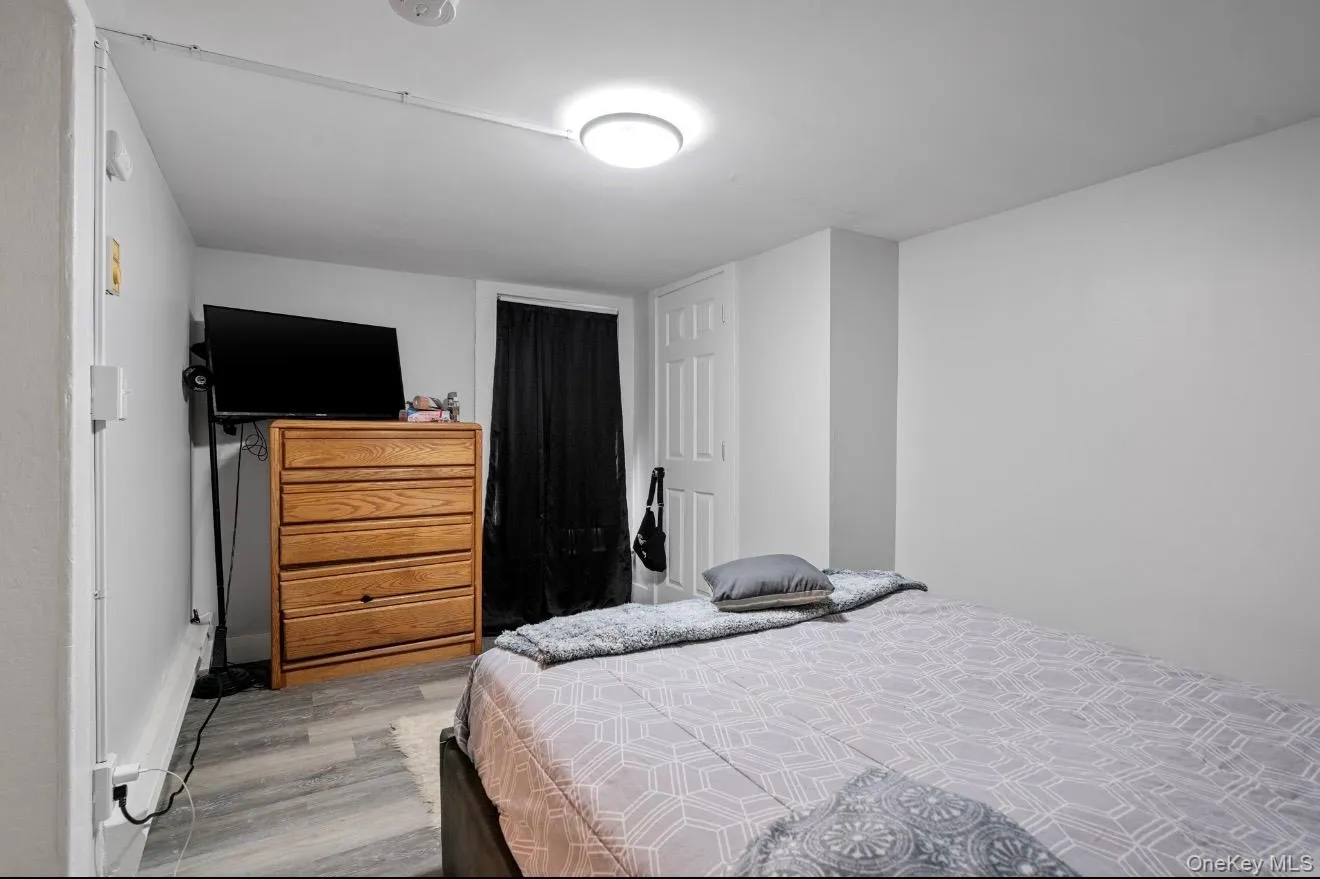Bedroom featuring light wood-type flooring Bedroom featuring light wood-type flooring