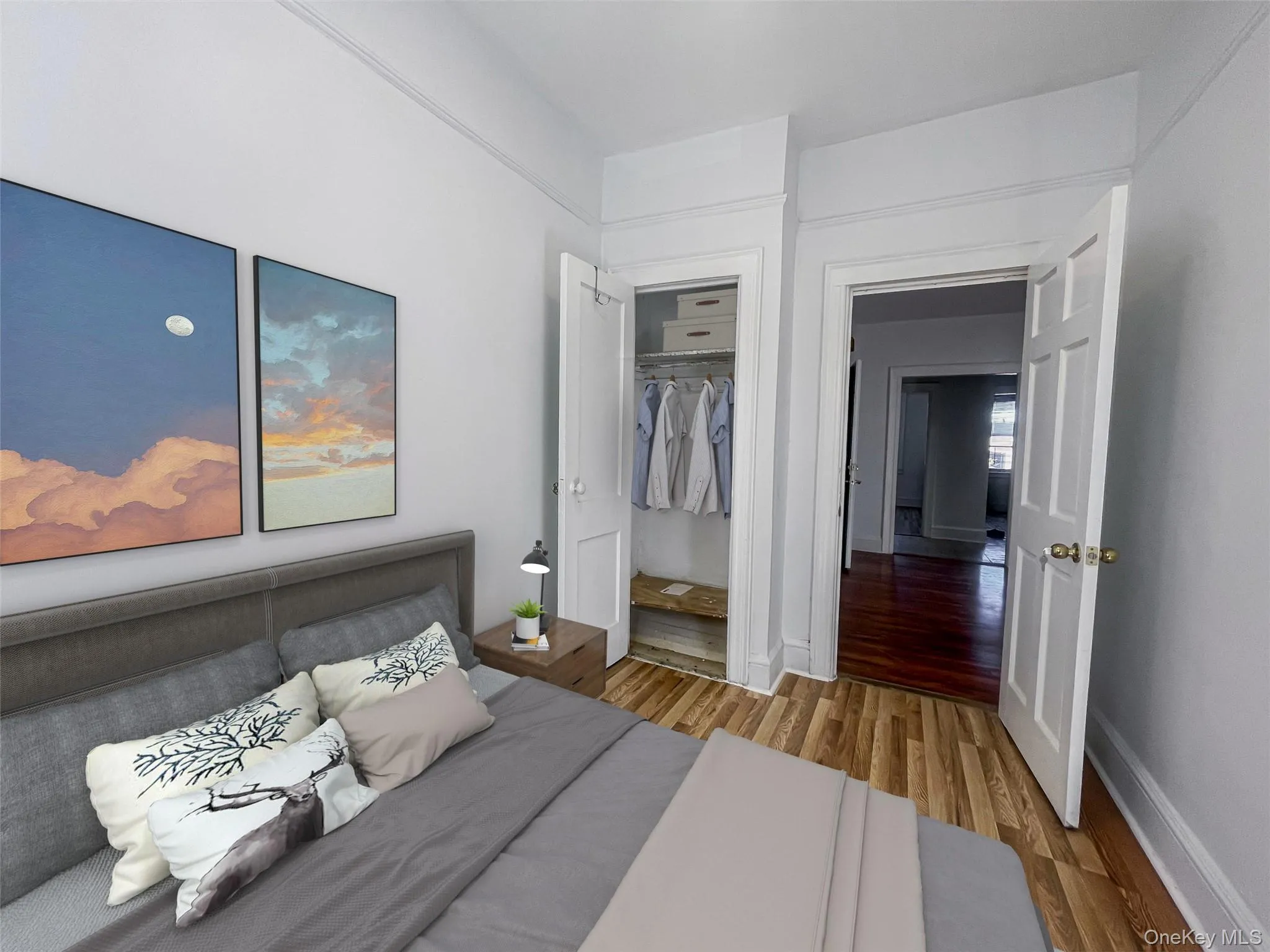 Bedroom featuring light wood finished floors Bedroom featuring light wood finished floors