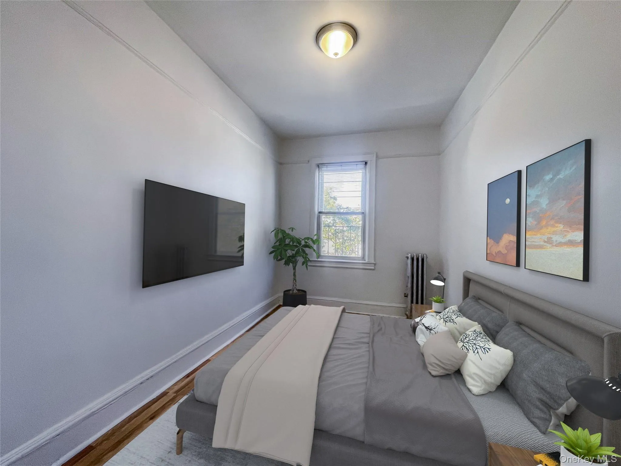 Bedroom with wood finished floors and radiator Bedroom with wood finished floors and radiator