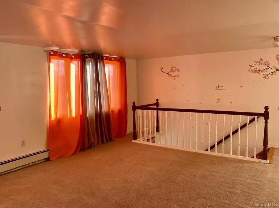 Empty room with carpet flooring Empty room with carpet flooring