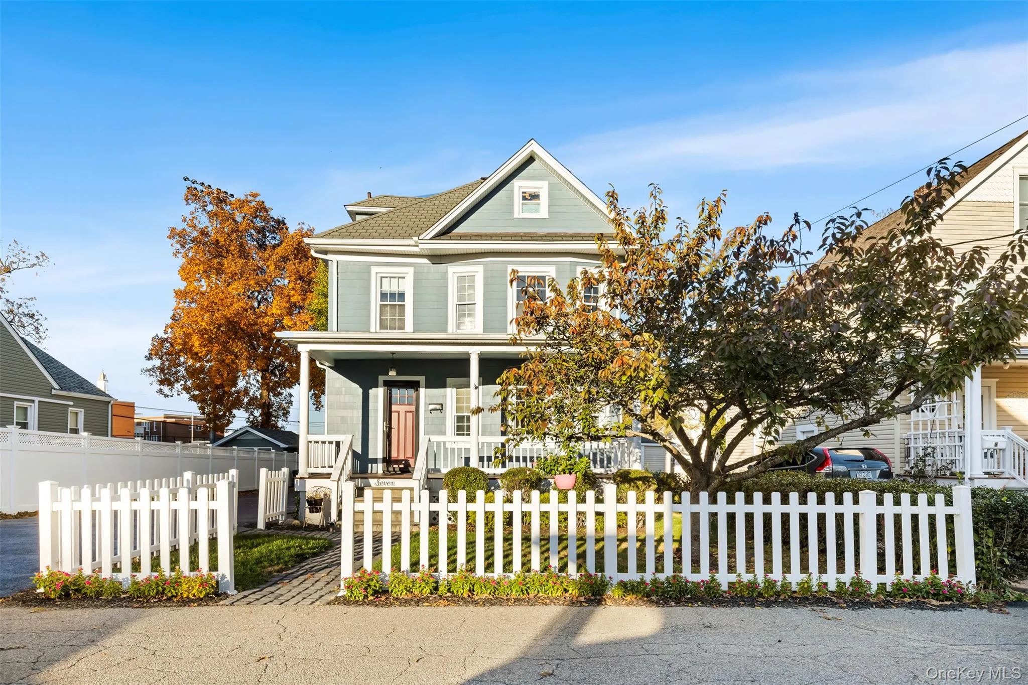 View of front of house featuring a porch and a fenced front yard View of front of house featuring a porch and a fenced front yard