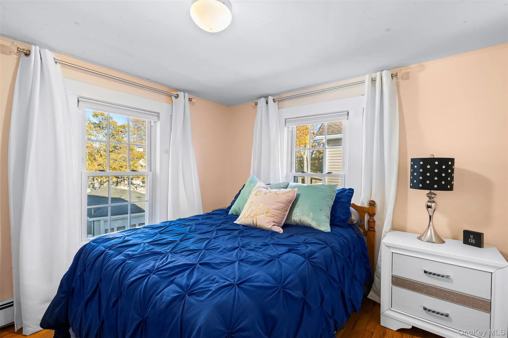 Bedroom with access to exterior and wood finished floors Bedroom with access to exterior and wood finished floors