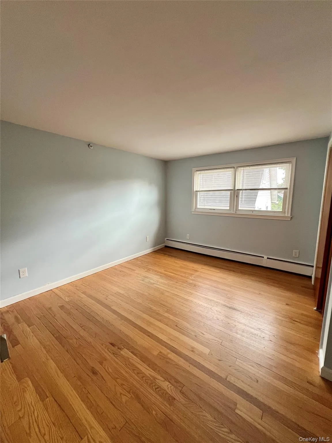 BED 1 queen /king baseboard heating unit and light wood-type flooring BED 1 queen /king baseboard heating unit and light wood-type flooring