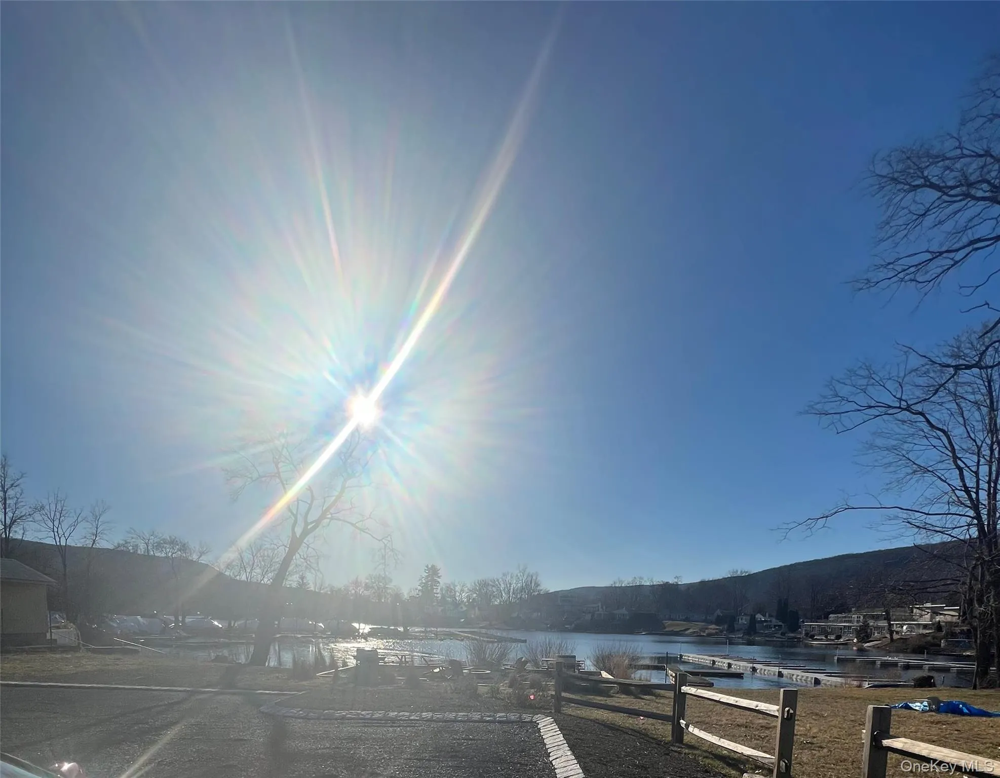 View of road featuring a water view View of road featuring a water view