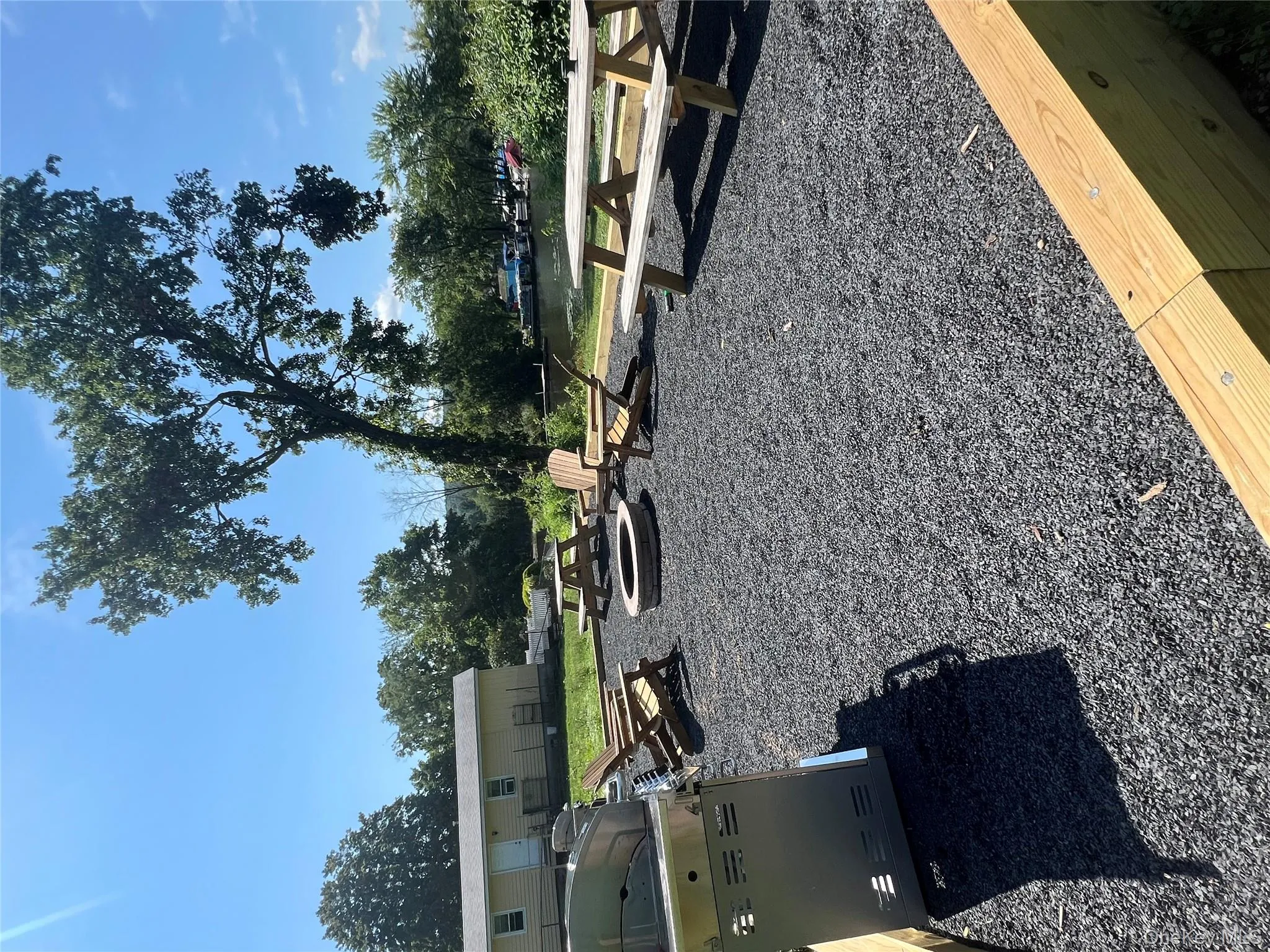 View of yard featuring a fire pit View of yard featuring a fire pit