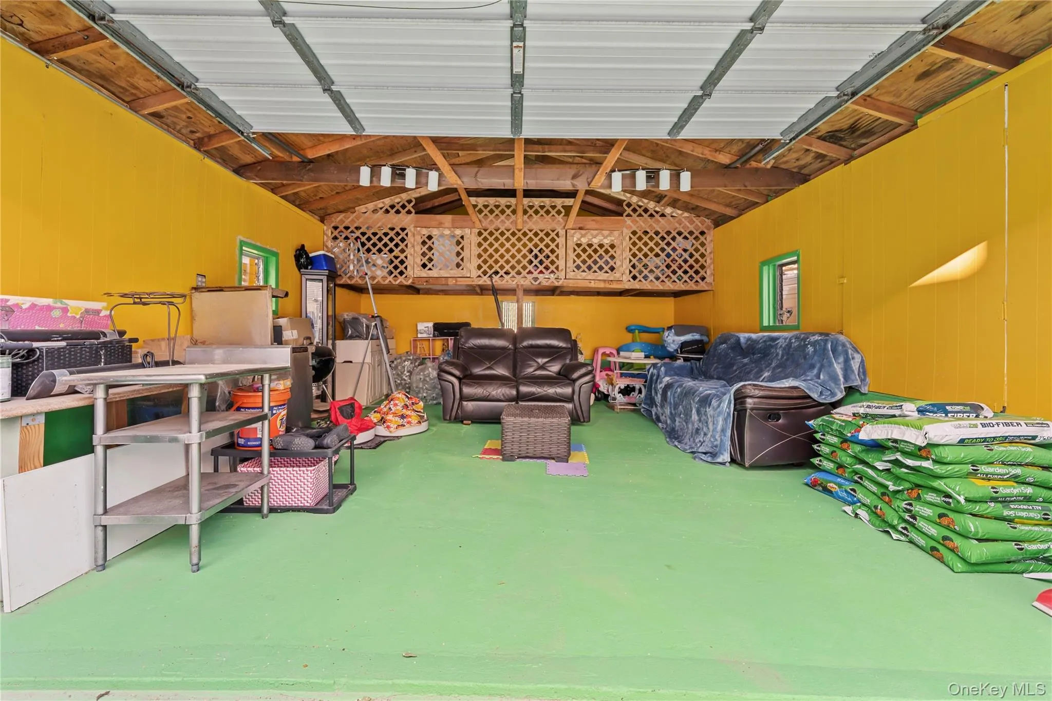 Garage featuring wood walls Garage featuring wood walls