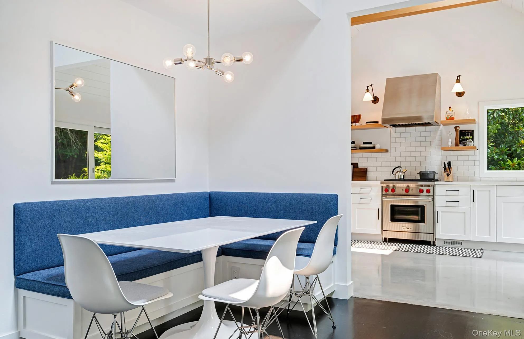 Dining space with breakfast area and dark wood-style floors Dining space with breakfast area and dark wood-style floors