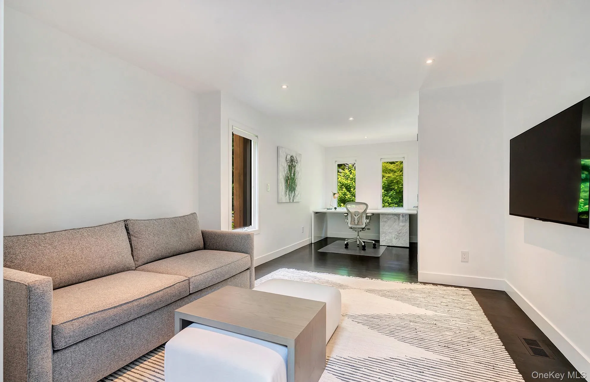 Living area with a desk, dark wood finished floors, and recessed lighting Living area with a desk, dark wood finished floors, and recessed lighting