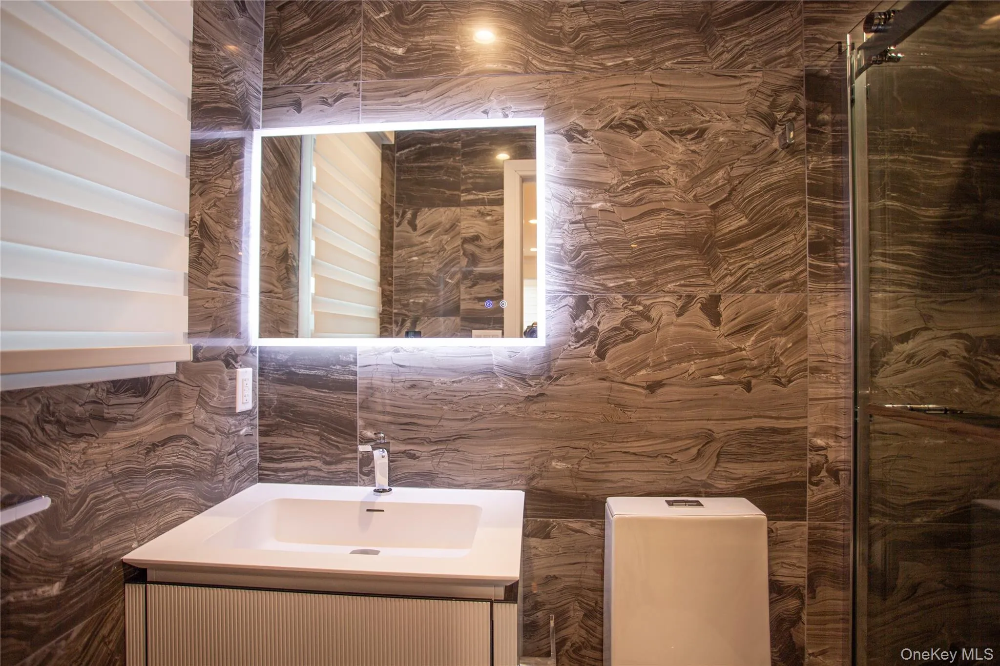 Bathroom with vanity and tile walls Bathroom with vanity and tile walls