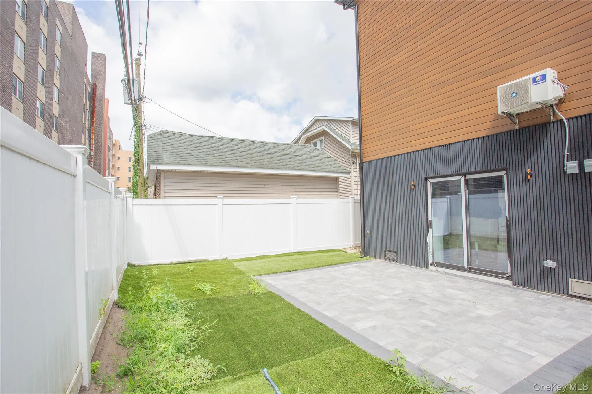 Fenced backyard featuring a patio area Fenced backyard featuring a patio area