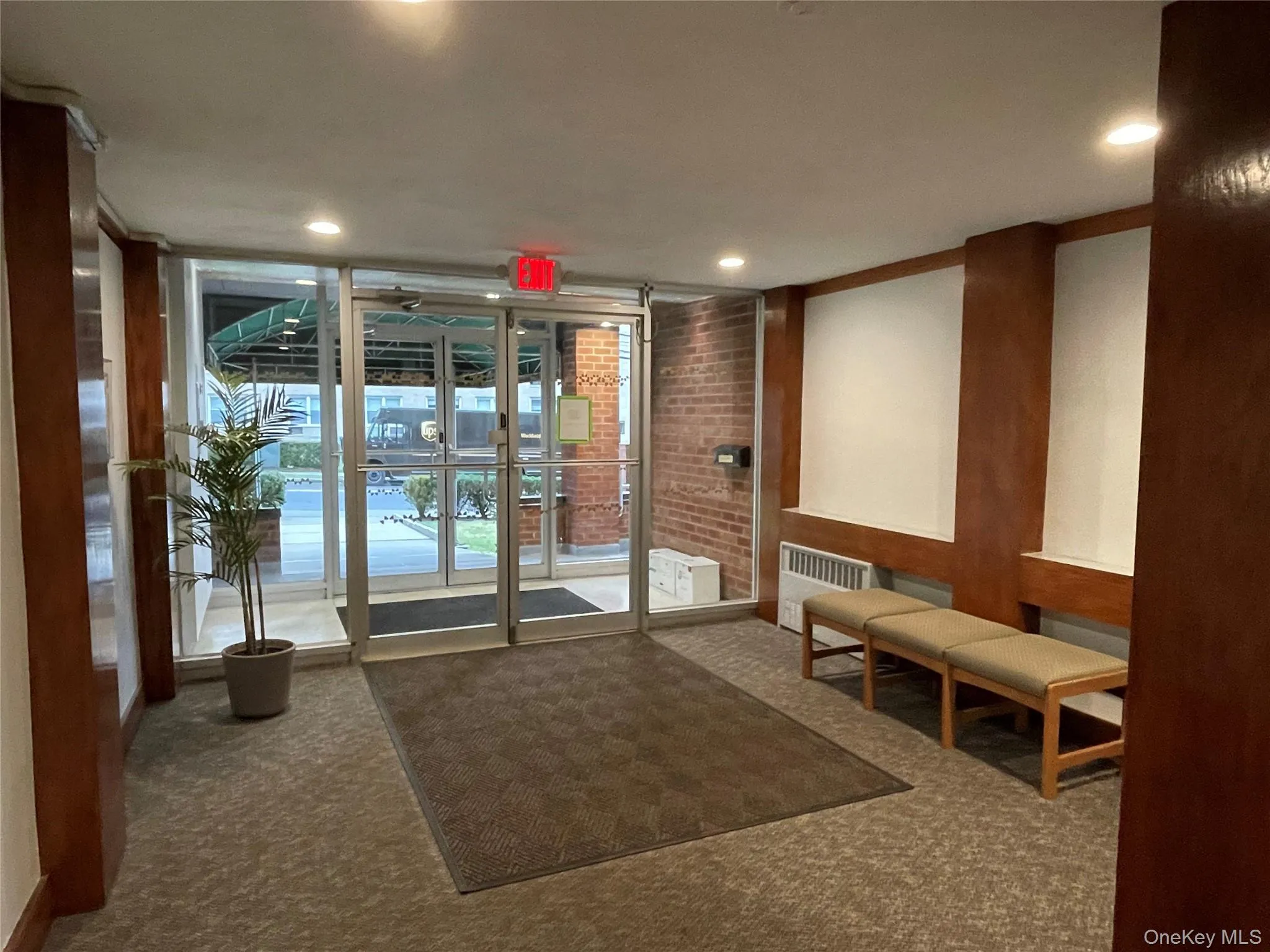 Community lobby with floor to ceiling windows Community lobby with floor to ceiling windows