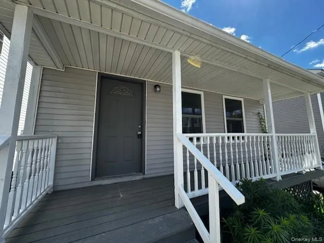 Entrance to property featuring covered porch Entrance to property featuring covered porch