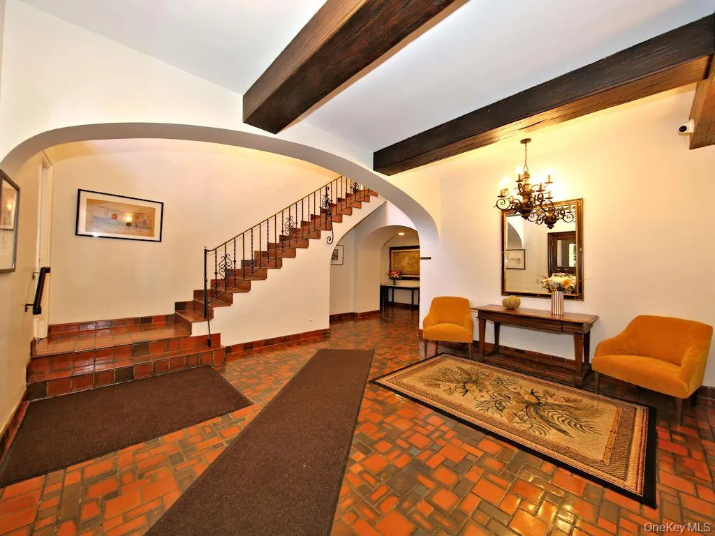 Lobby with beam ceiling and stairs Lobby with beam ceiling and stairs