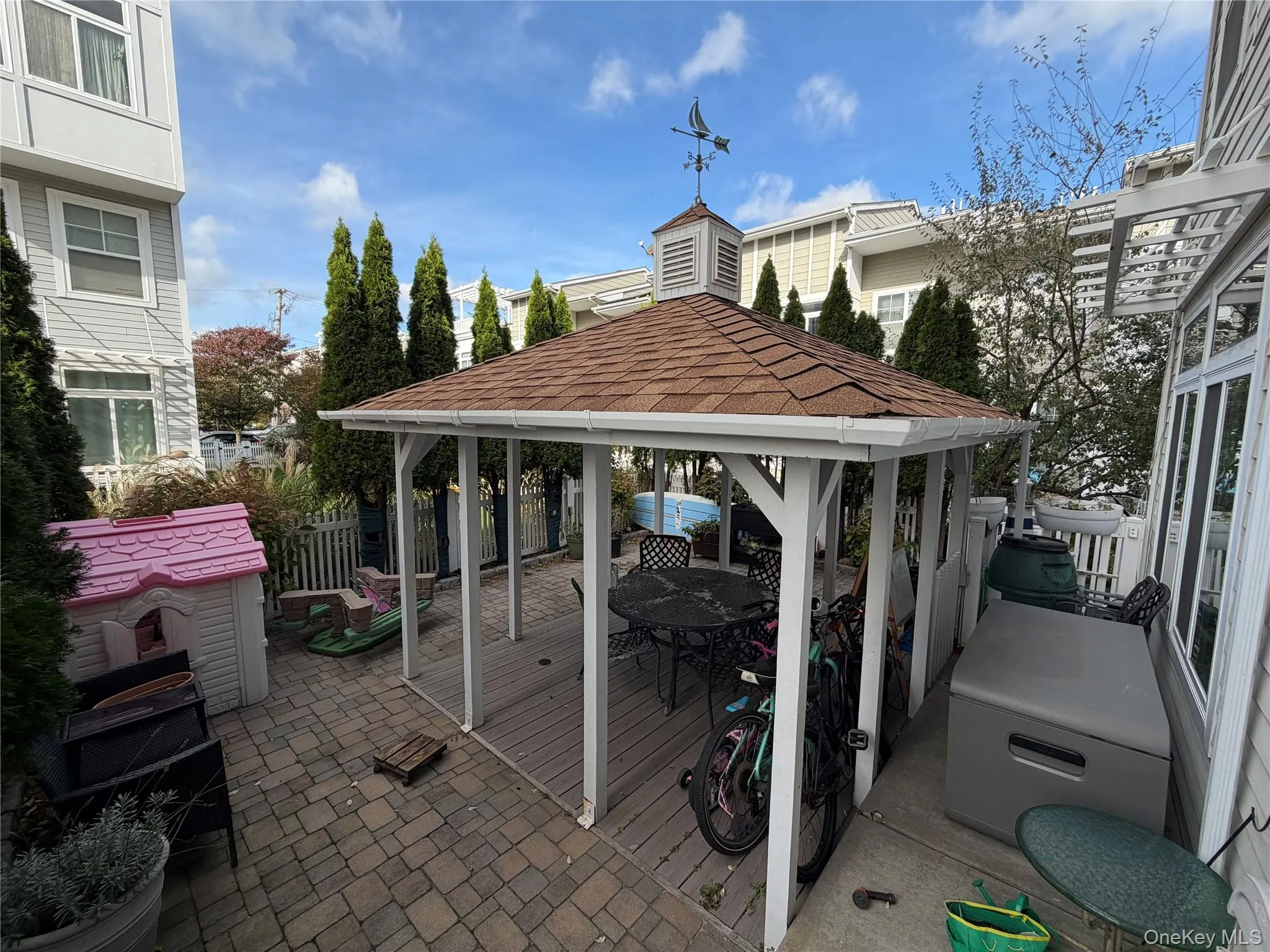View of patio featuring a deck and a gazebo View of patio featuring a deck and a gazebo