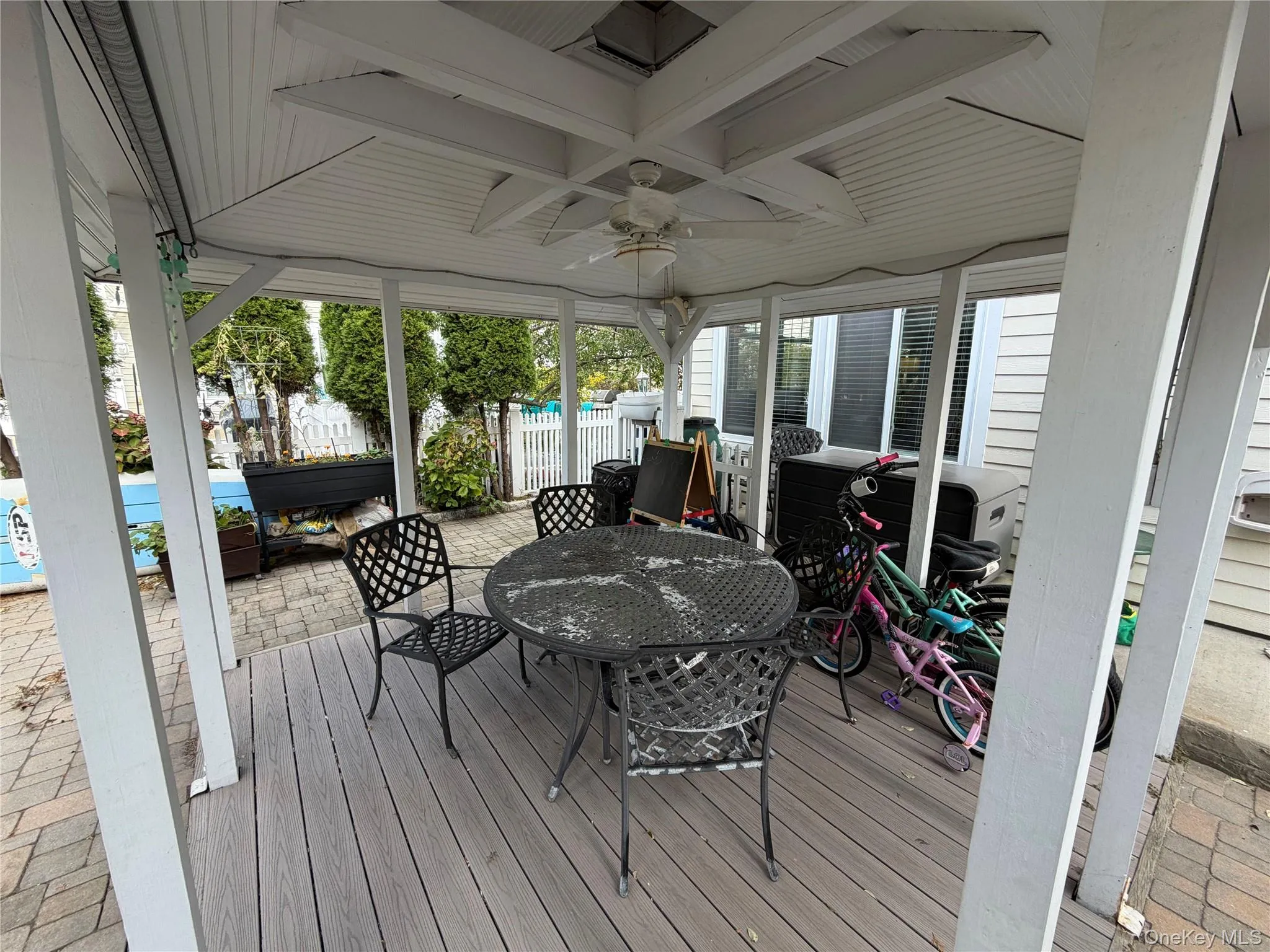 Deck featuring outdoor dining space, ceiling fan, and a pool Deck featuring outdoor dining space, ceiling fan, and a pool
