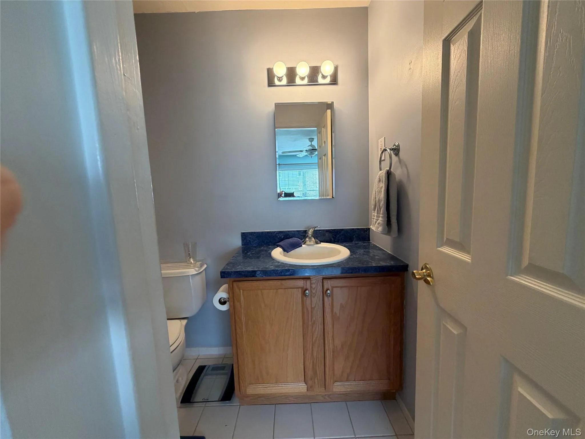 Bathroom with light tile patterned floors and vanity Bathroom with light tile patterned floors and vanity