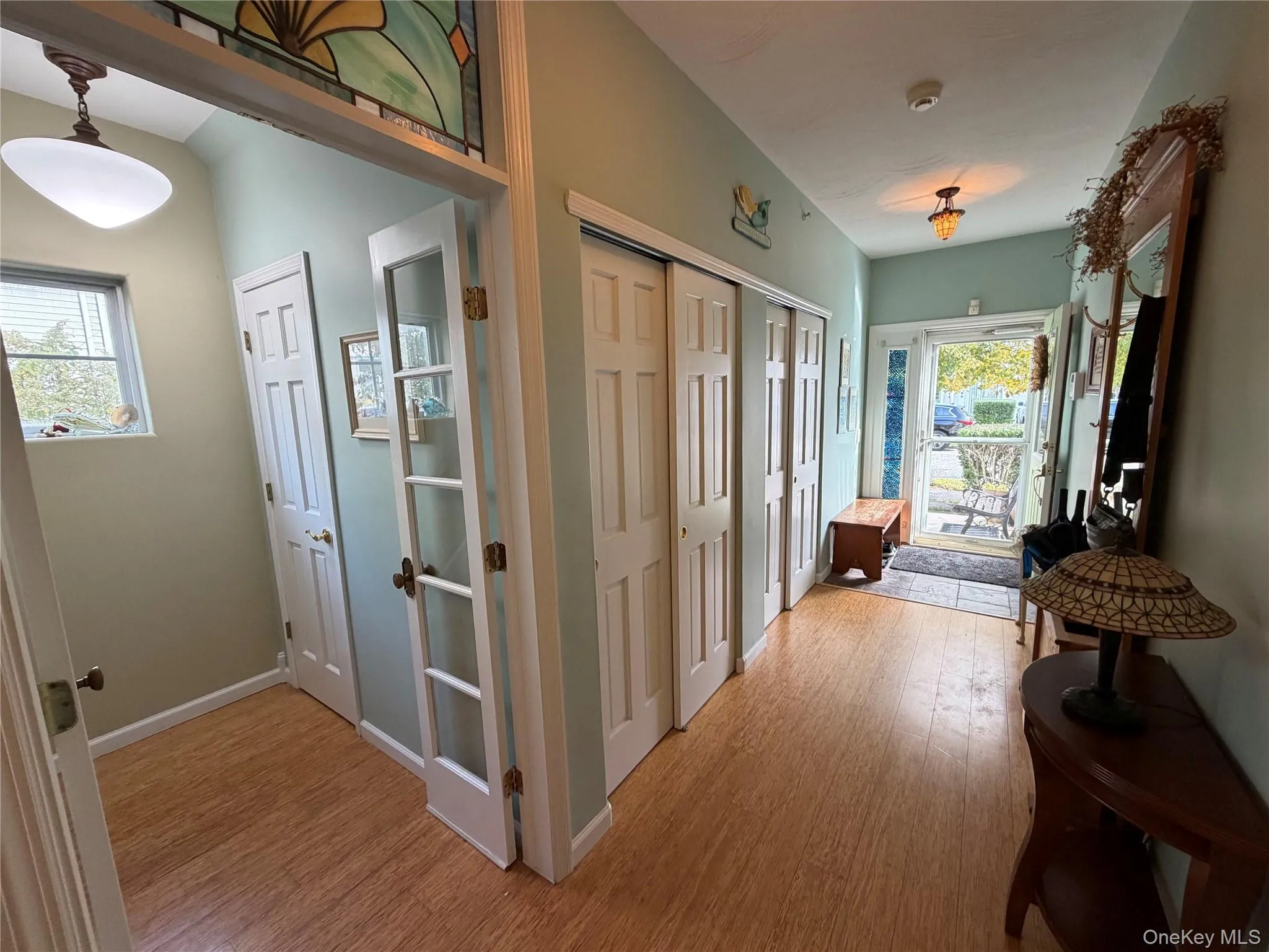 Hall with light wood-style floors and baseboards Hall with light wood-style floors and baseboards