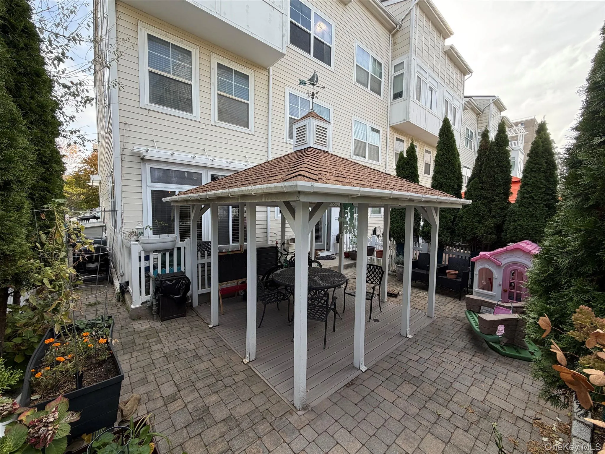 View of patio / terrace featuring a gazebo, outdoor dining space, and a grill View of patio / terrace featuring a gazebo, outdoor dining space, and a grill
