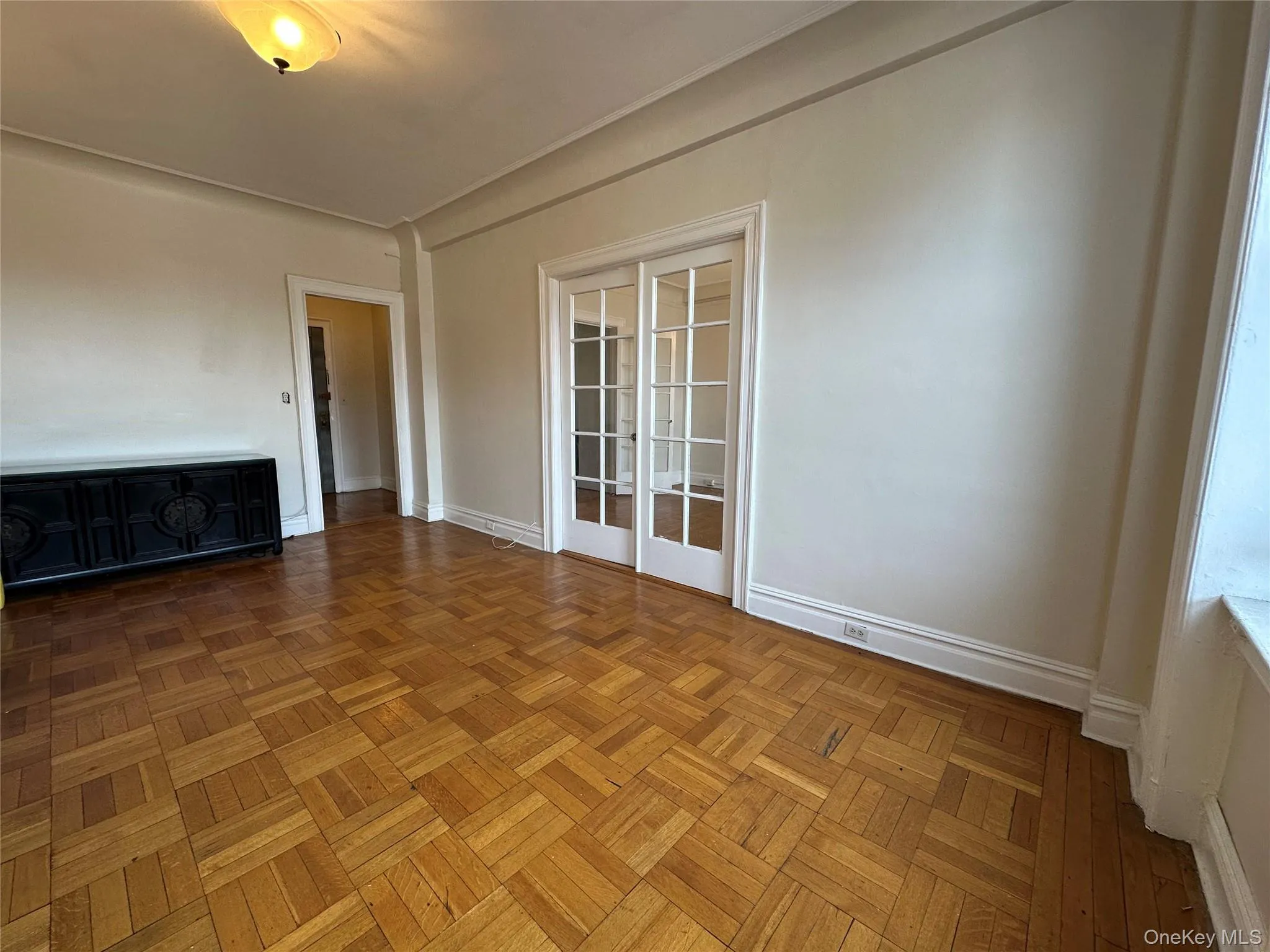 Unfurnished room with baseboards Unfurnished room with baseboards