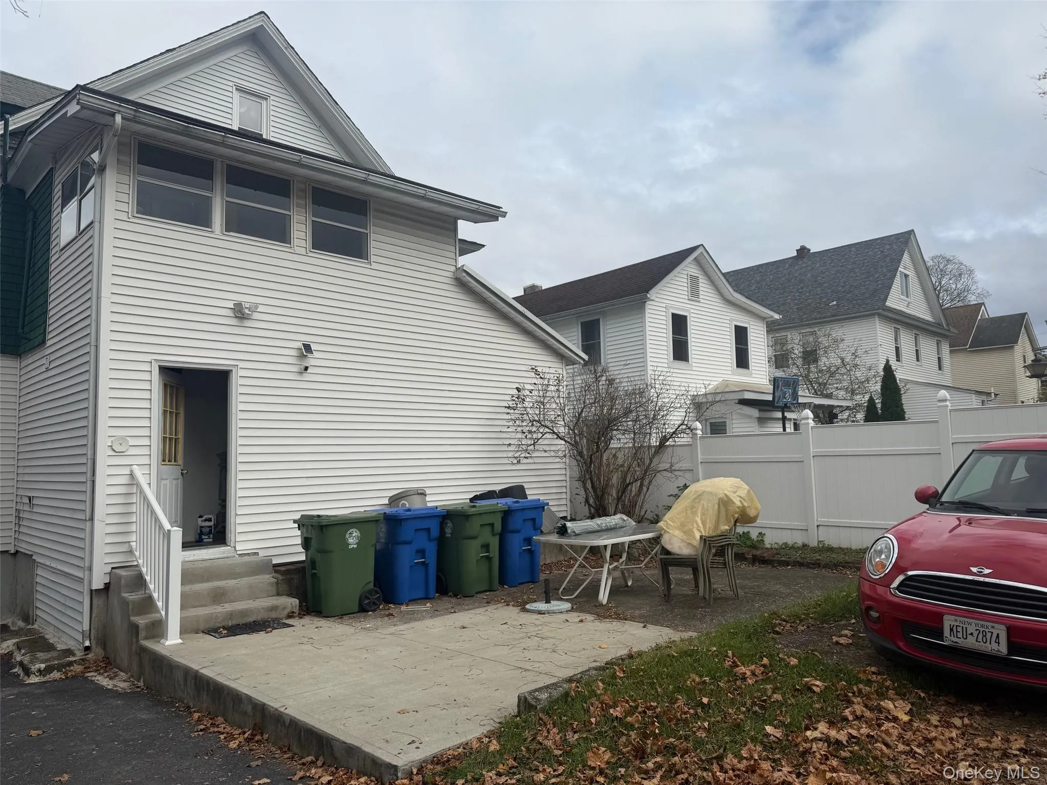 Rear view of house with a patio and entry steps Rear view of house with a patio and entry steps