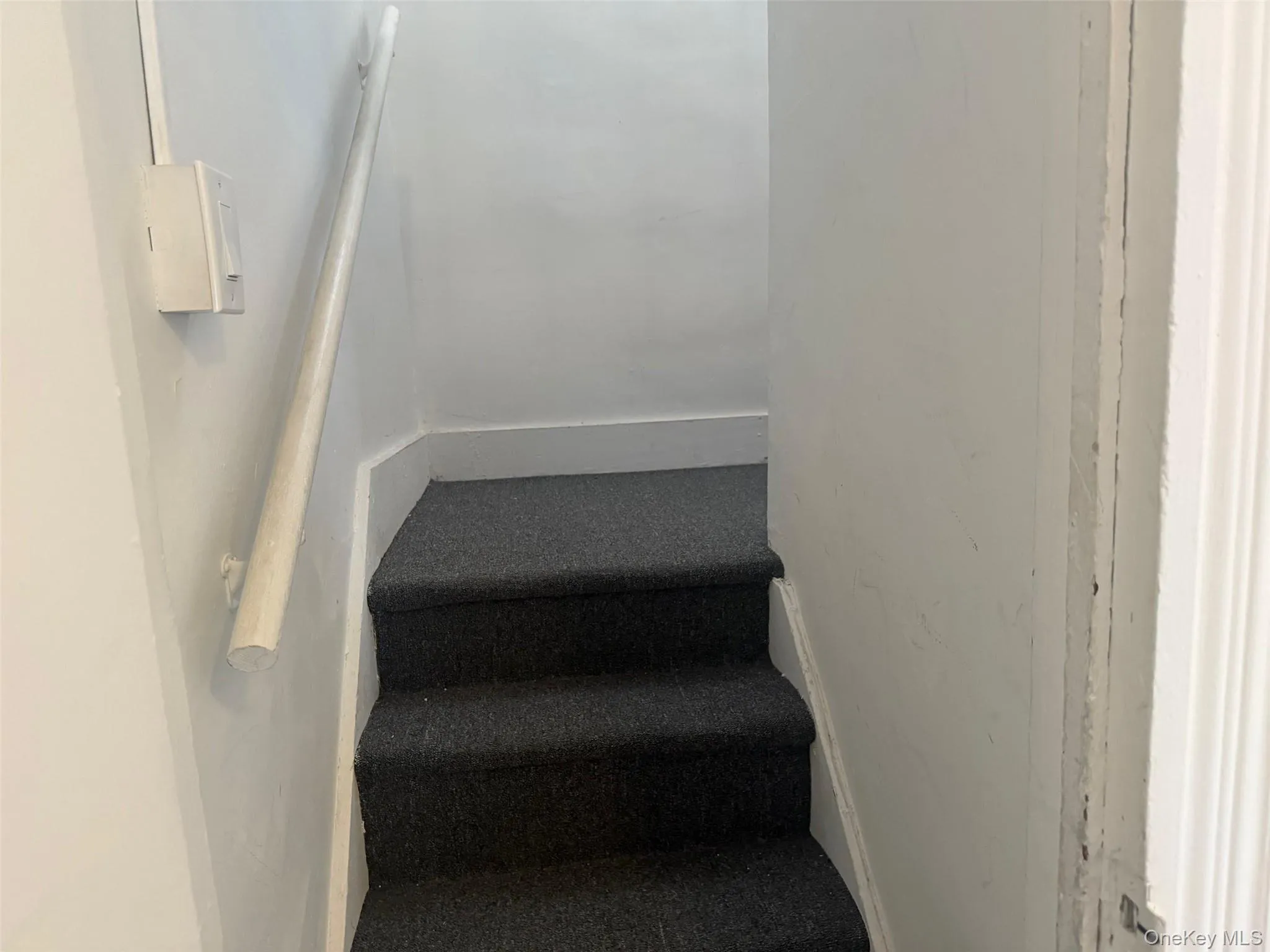 View of stairway going up to storage area View of stairway going up to storage area