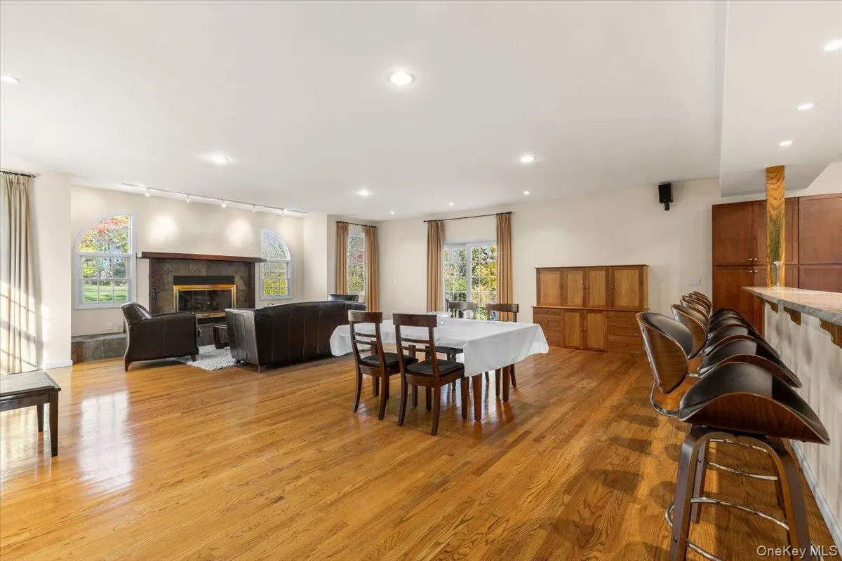 Sliding glass doors to exterior bluestone patio from the family room Sliding glass doors to exterior bluestone patio from the family room