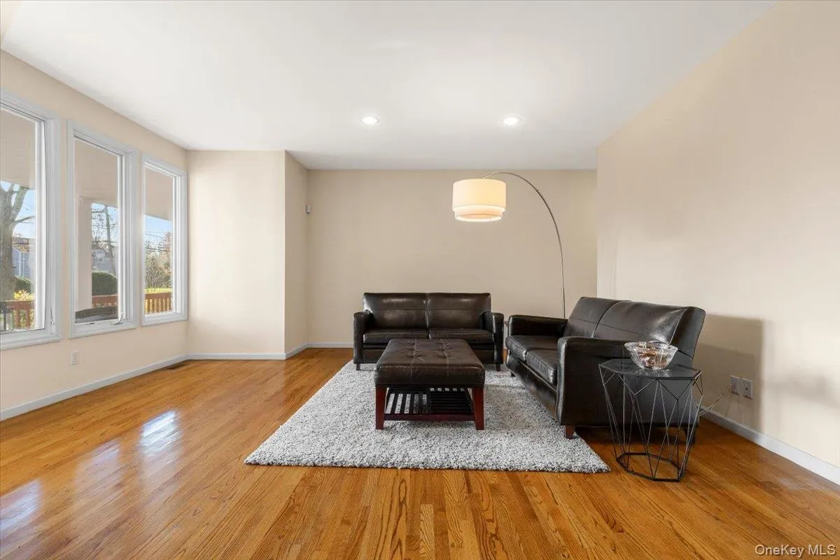 Generous entry foyer & formal living room with large windows Generous entry foyer & formal living room with large windows