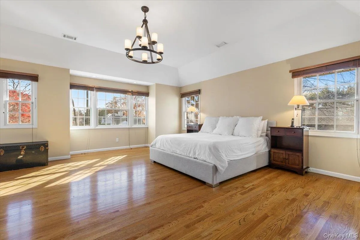 Primary Bedroom sunlit with many windows Primary Bedroom sunlit with many windows