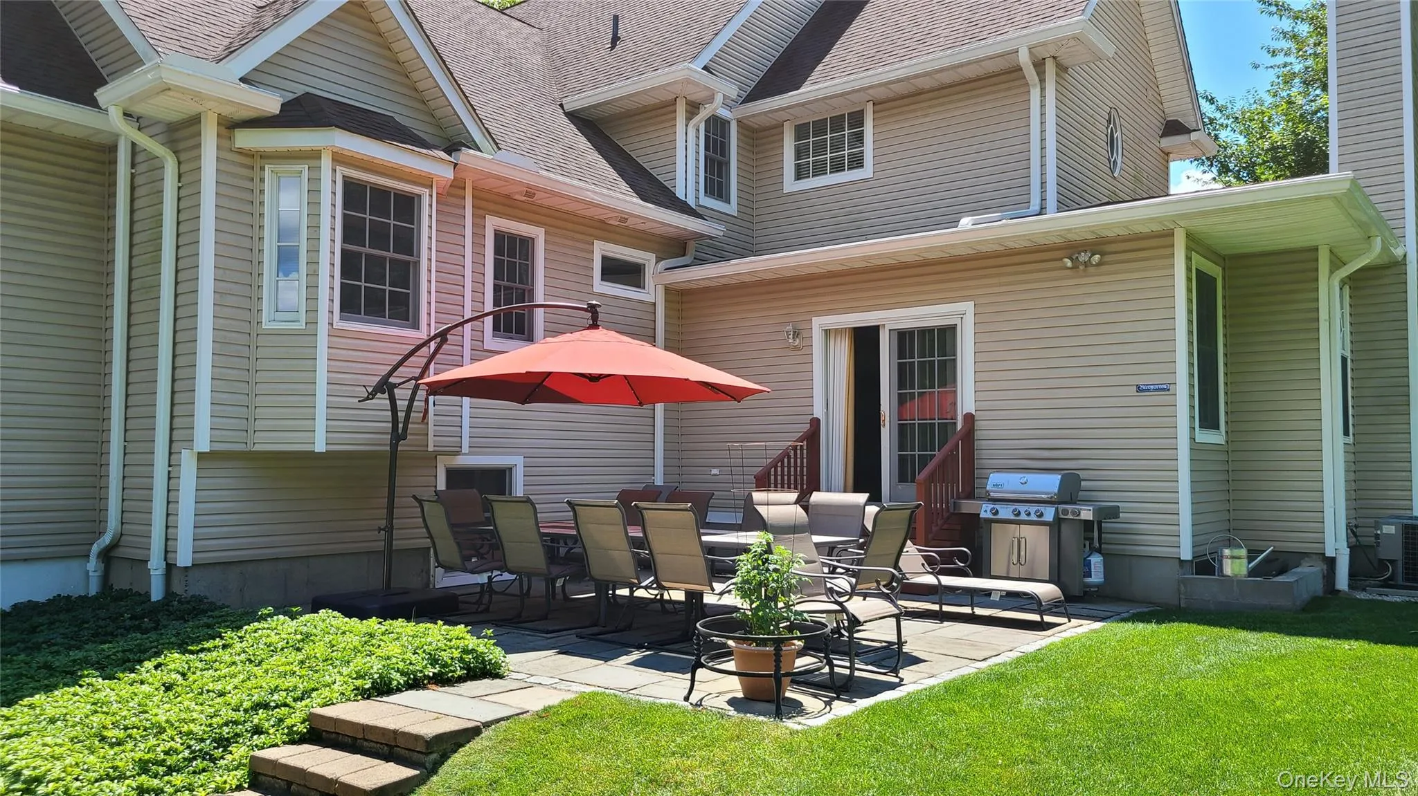 Rear of home with Patio, sliding doors enter into the Family Room Rear of home with Patio, sliding doors enter into the Family Room