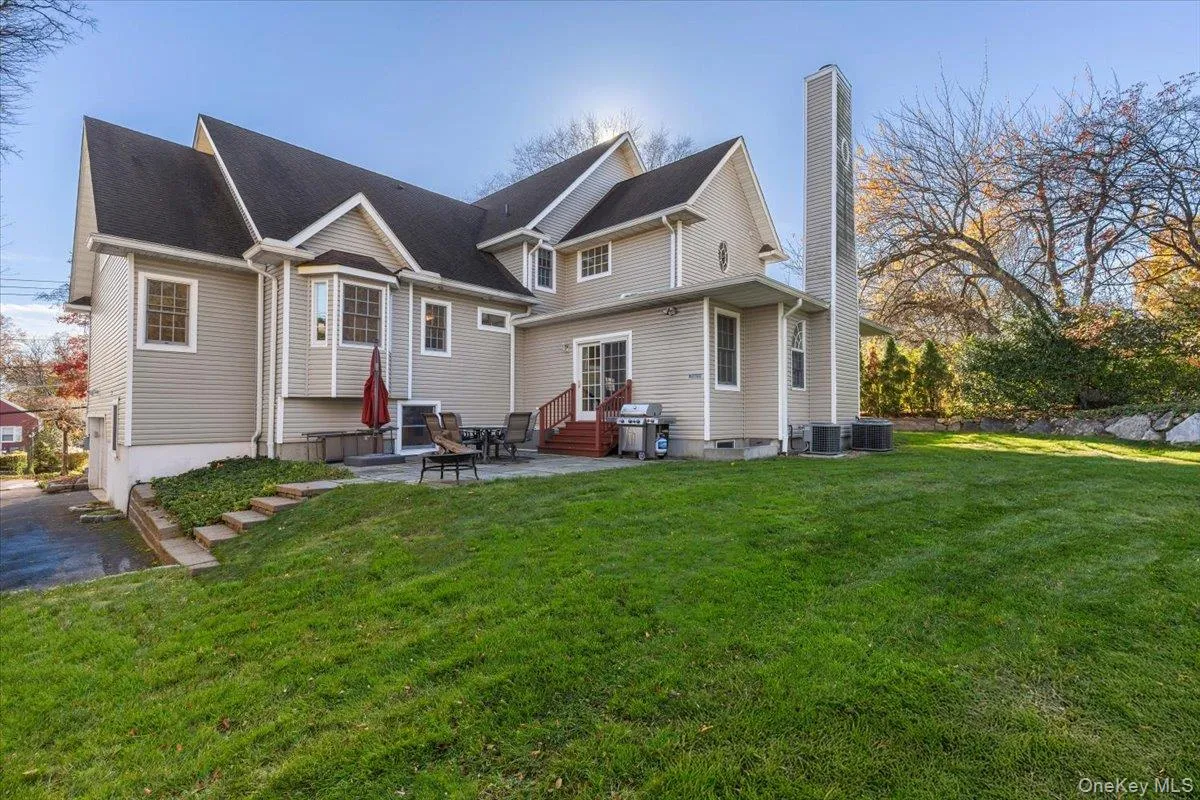 Back of home with a bluestone patio Back of home with a bluestone patio