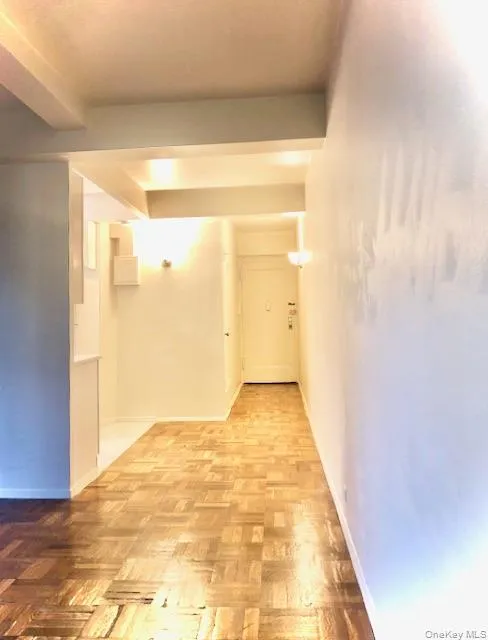 Corridor featuring baseboards Corridor featuring baseboards