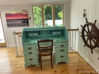 Sitting room with light wood-style flooring Sitting room with light wood-style flooring