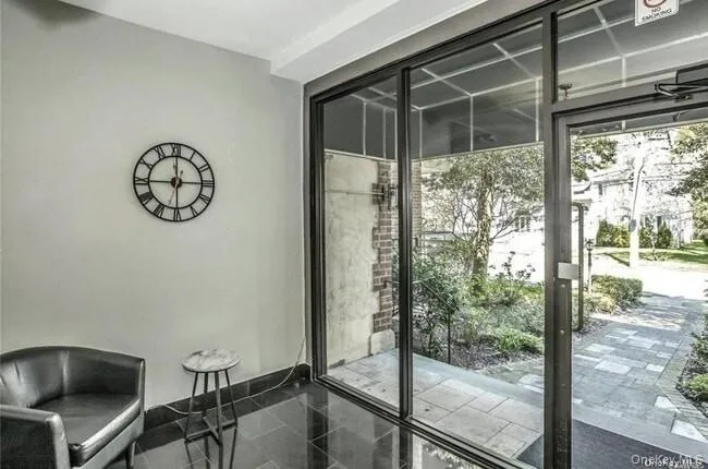 Doorway to outside with baseboards and granite tiled floors Doorway to outside with baseboards and granite tiled floors