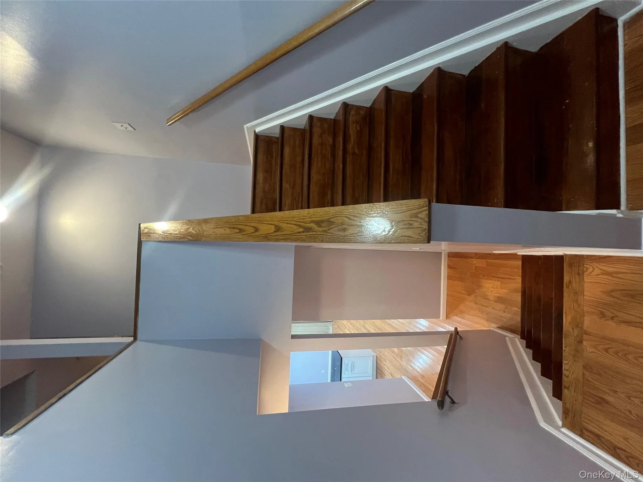 Stairway with wood finished floors and baseboards Stairway with wood finished floors and baseboards