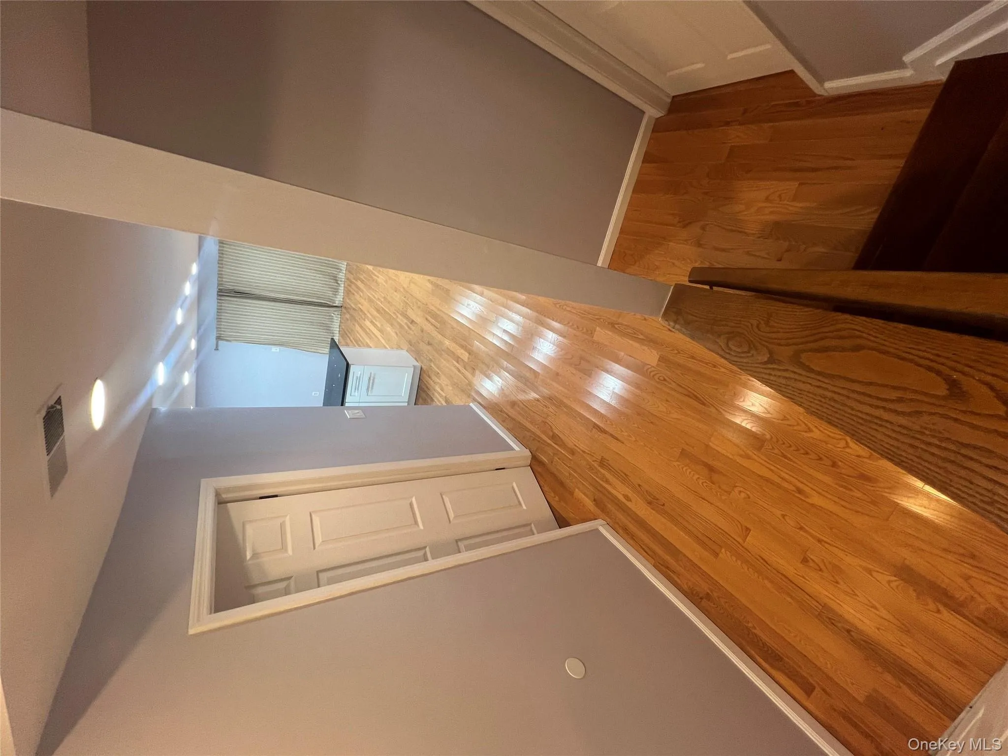 Corridor featuring light wood-style flooring Corridor featuring light wood-style flooring