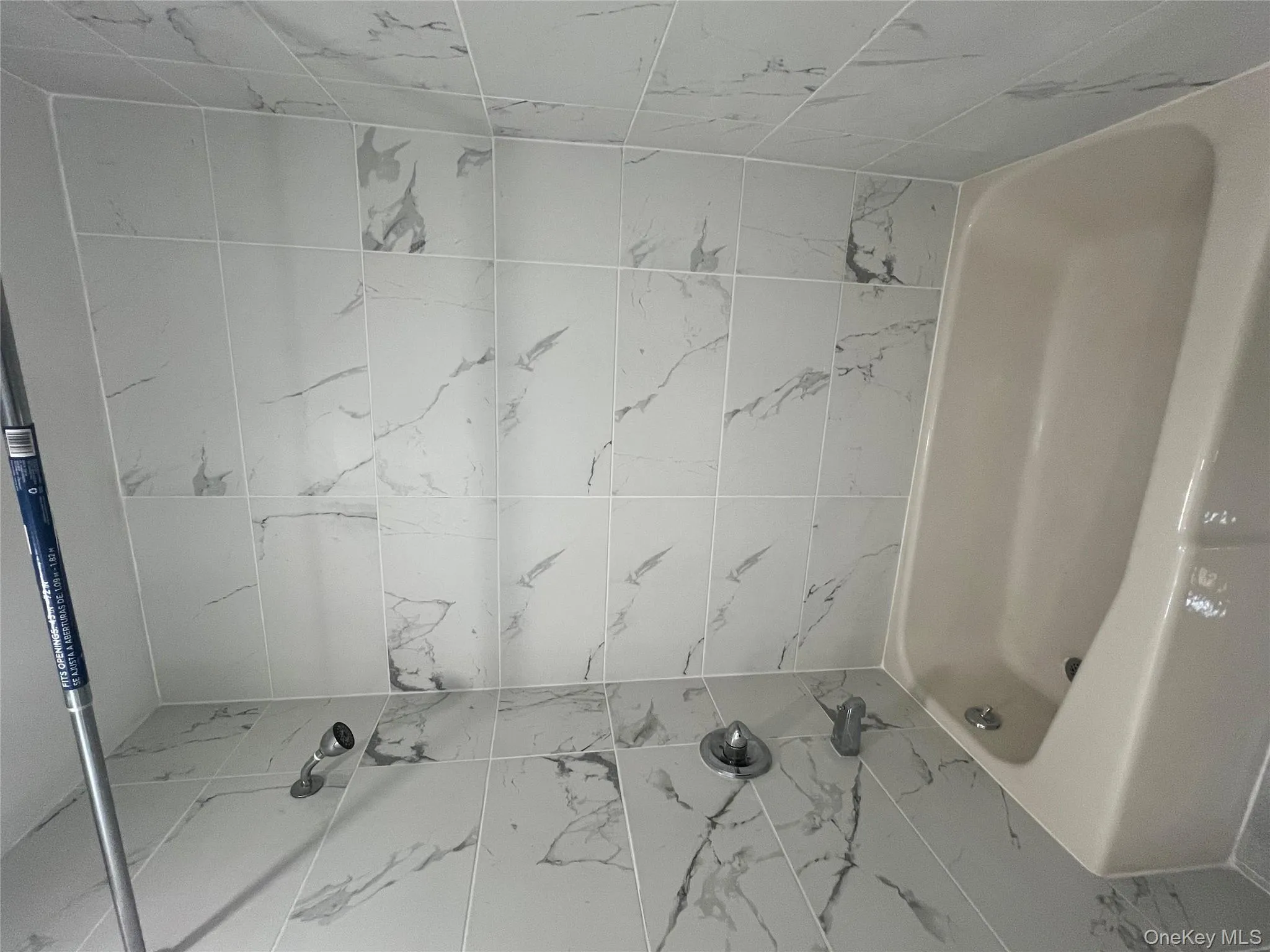 Full bathroom featuring tub / shower combination Full bathroom featuring tub / shower combination