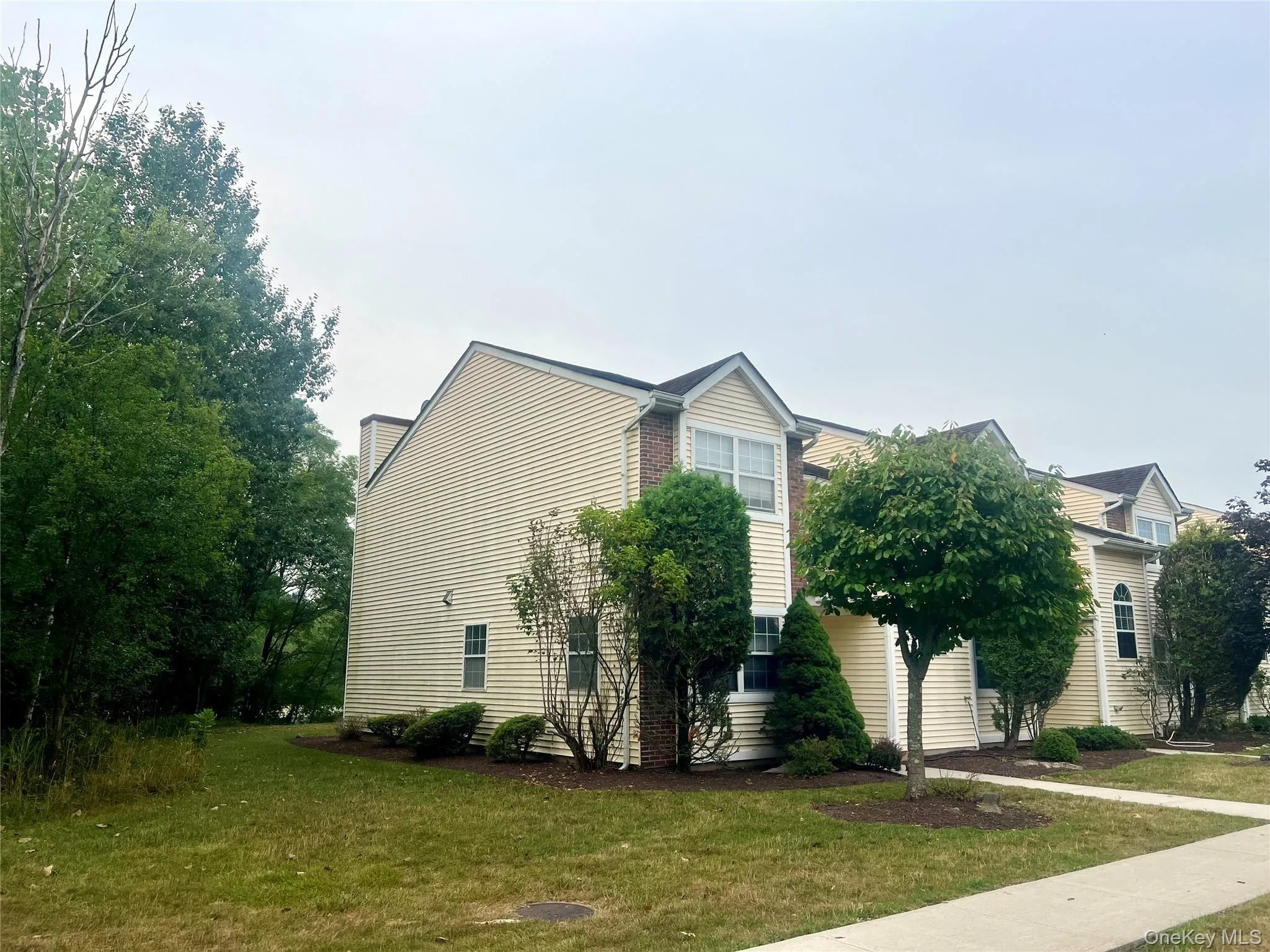 View of property exterior with a lawn View of property exterior with a lawn