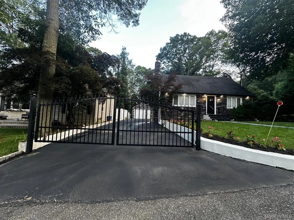 Gate featuring a yard Gate featuring a yard